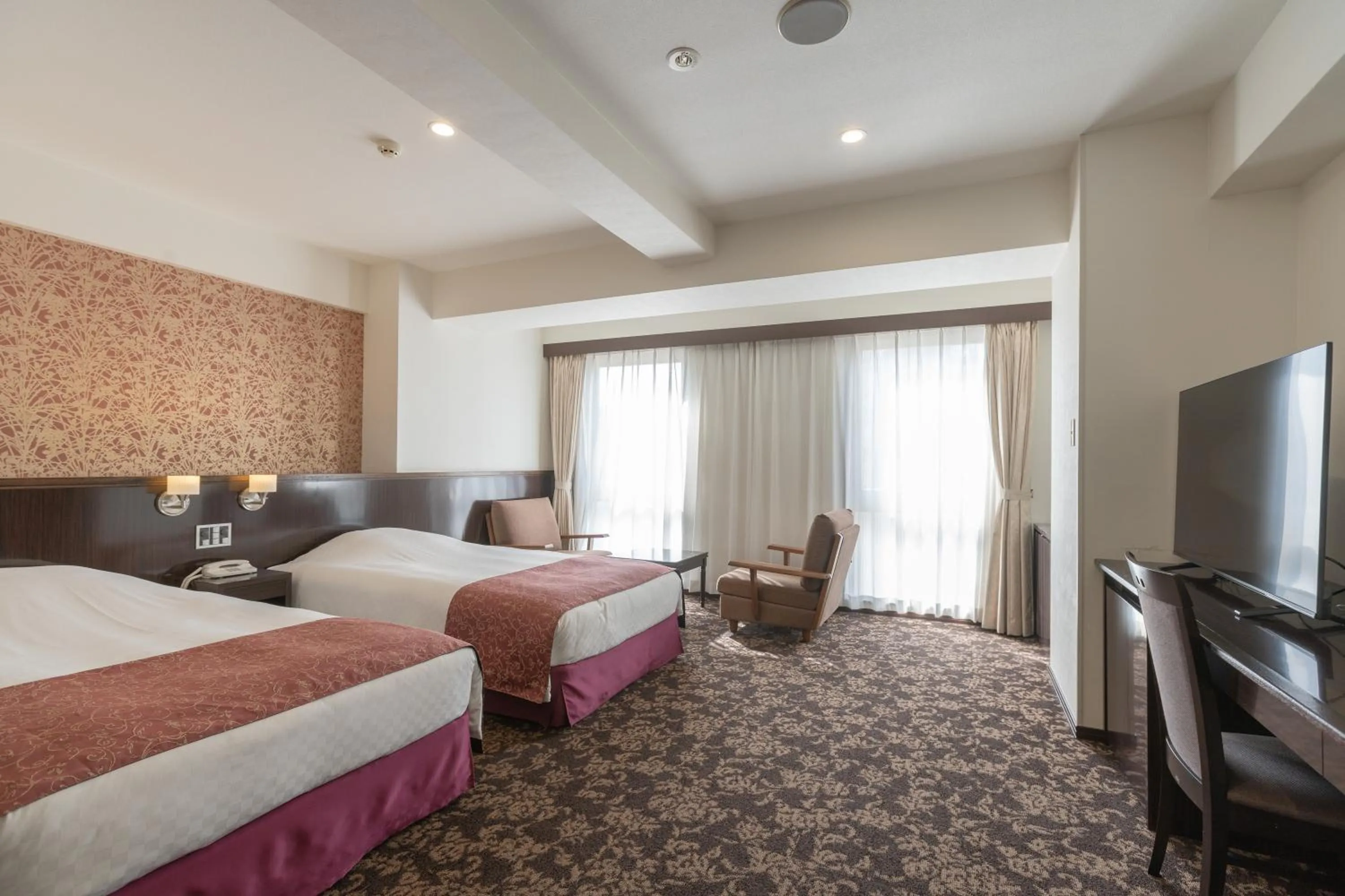 Bed in Libre Garden Hotel