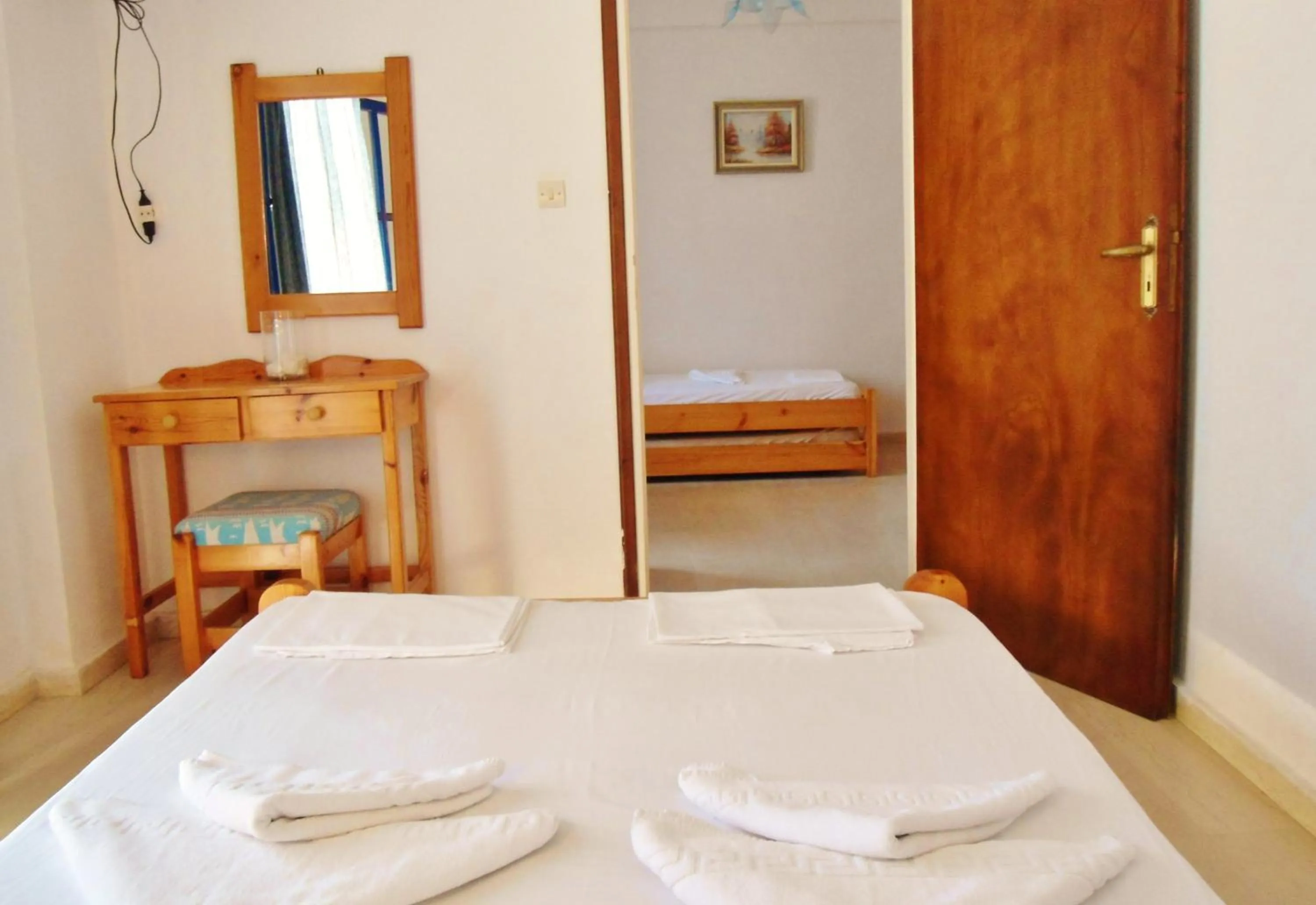 Bed in Apollonia Apartments