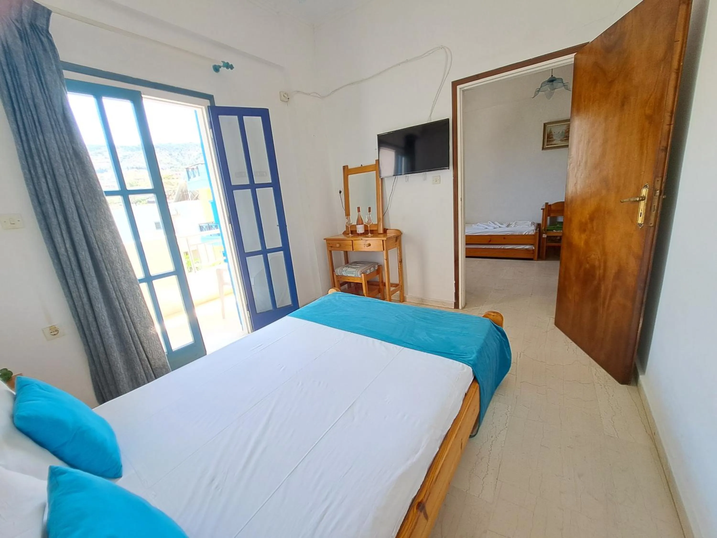 Bed in Apollonia Apartments