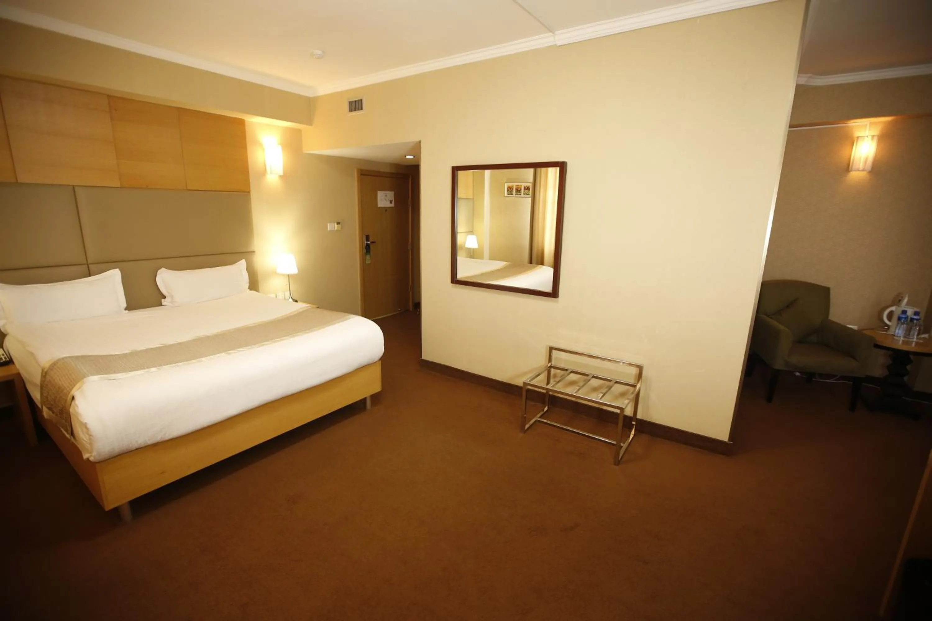 Bed in The Corporate Hotel