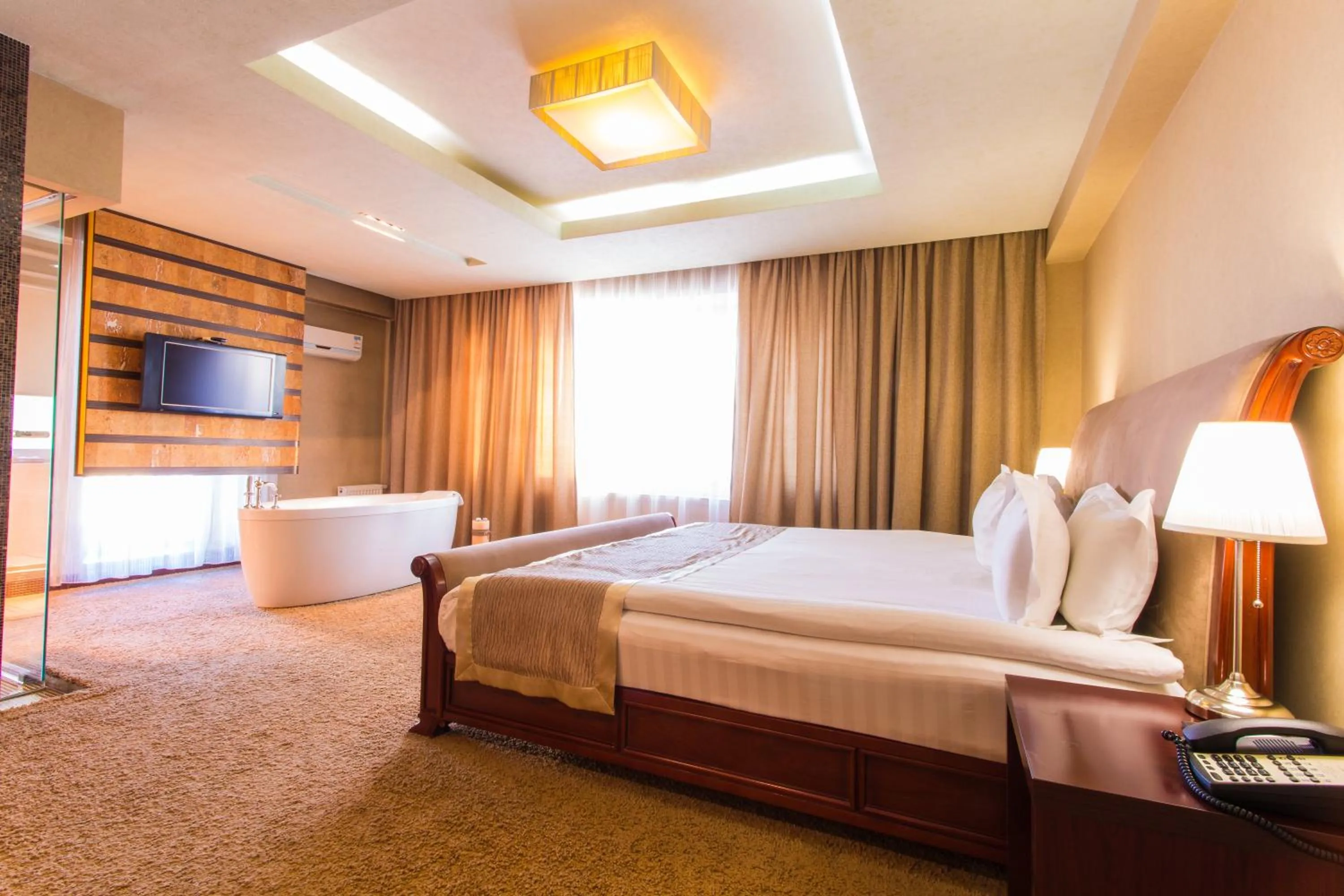 Bed in The Corporate Hotel