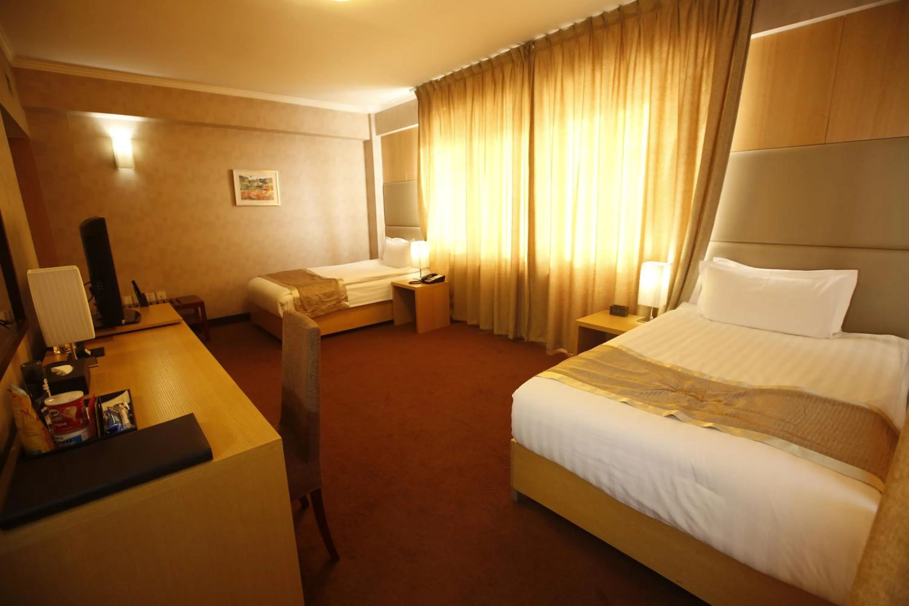 Bed in The Corporate Hotel