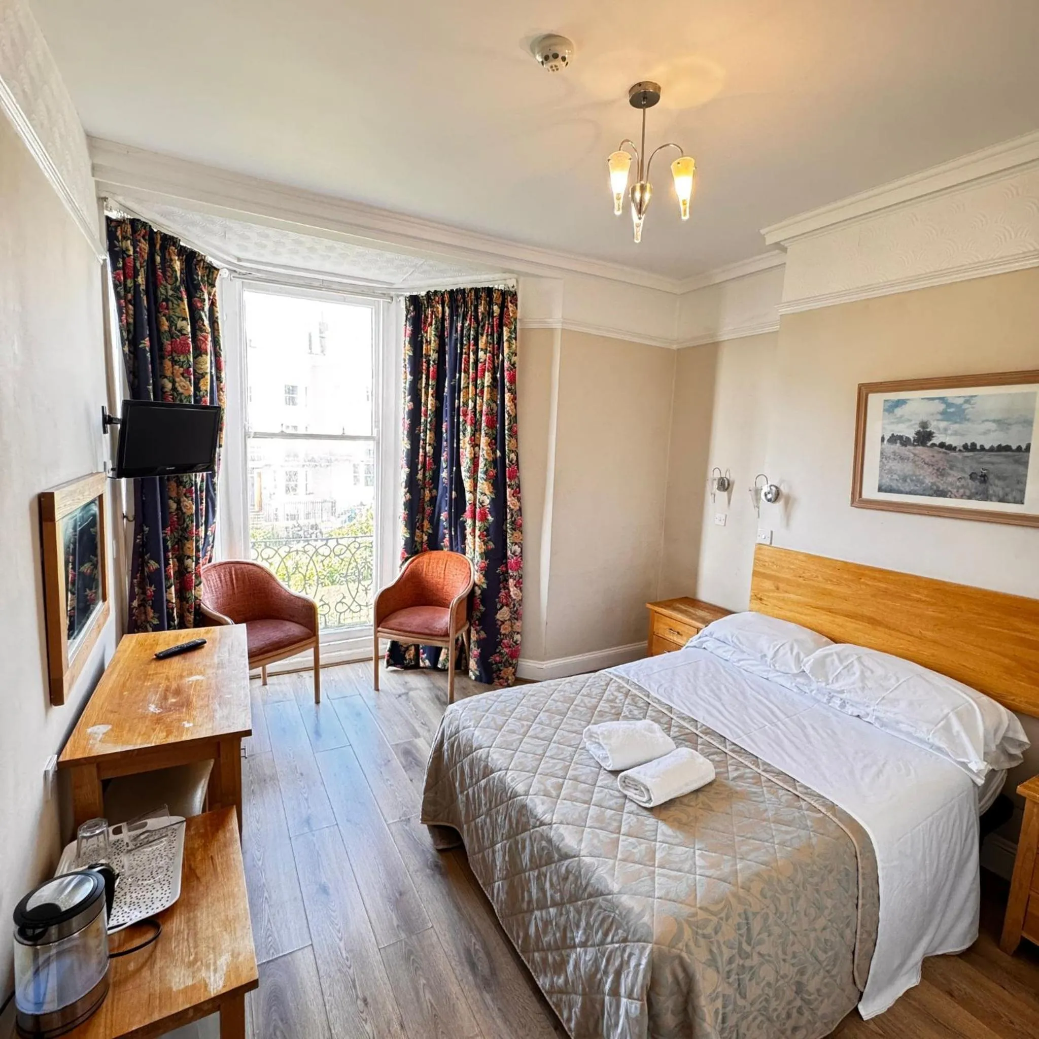 Bed in Ambassador Hotel