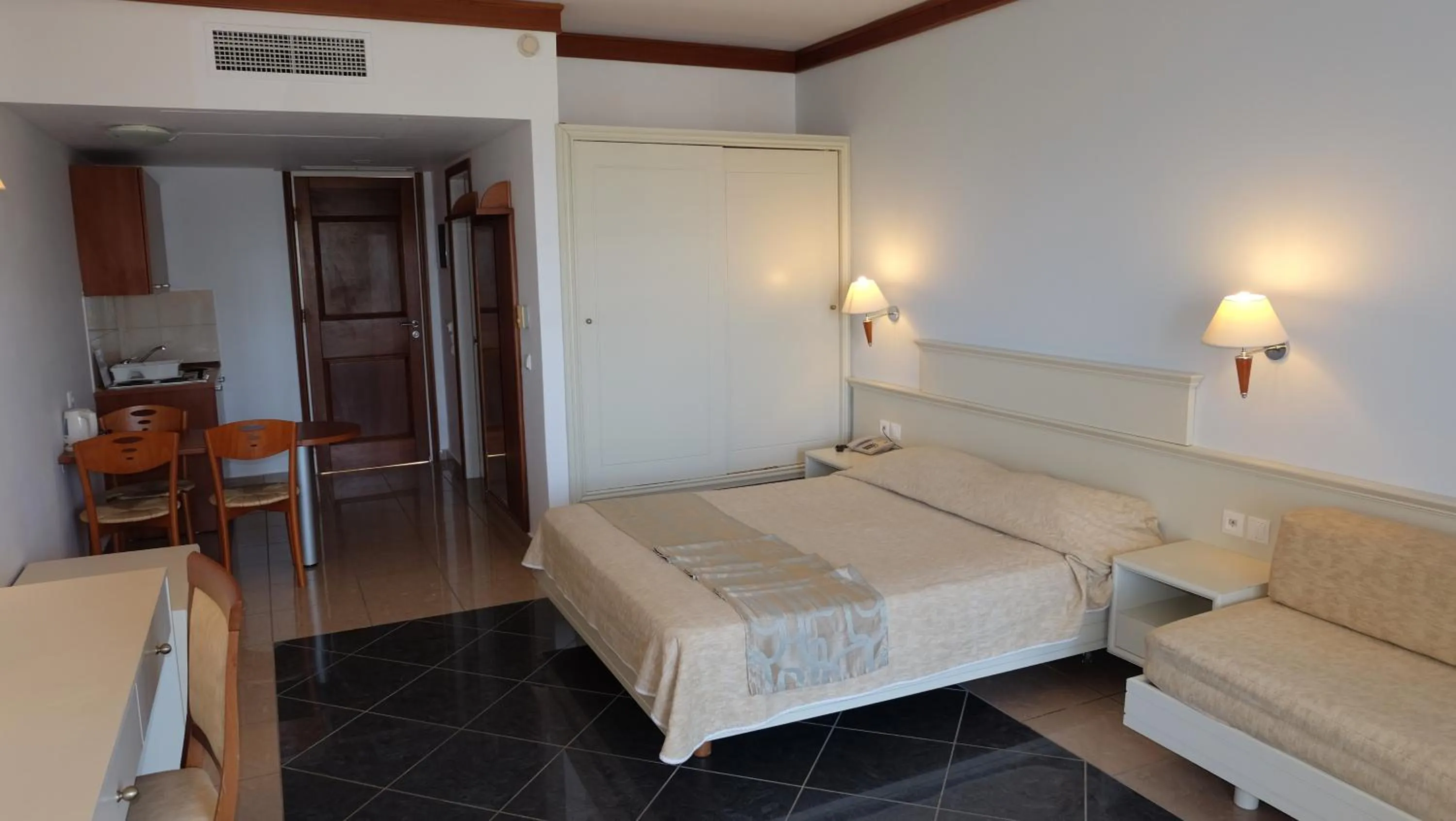 Bed in Kipriotis Maris Suites
