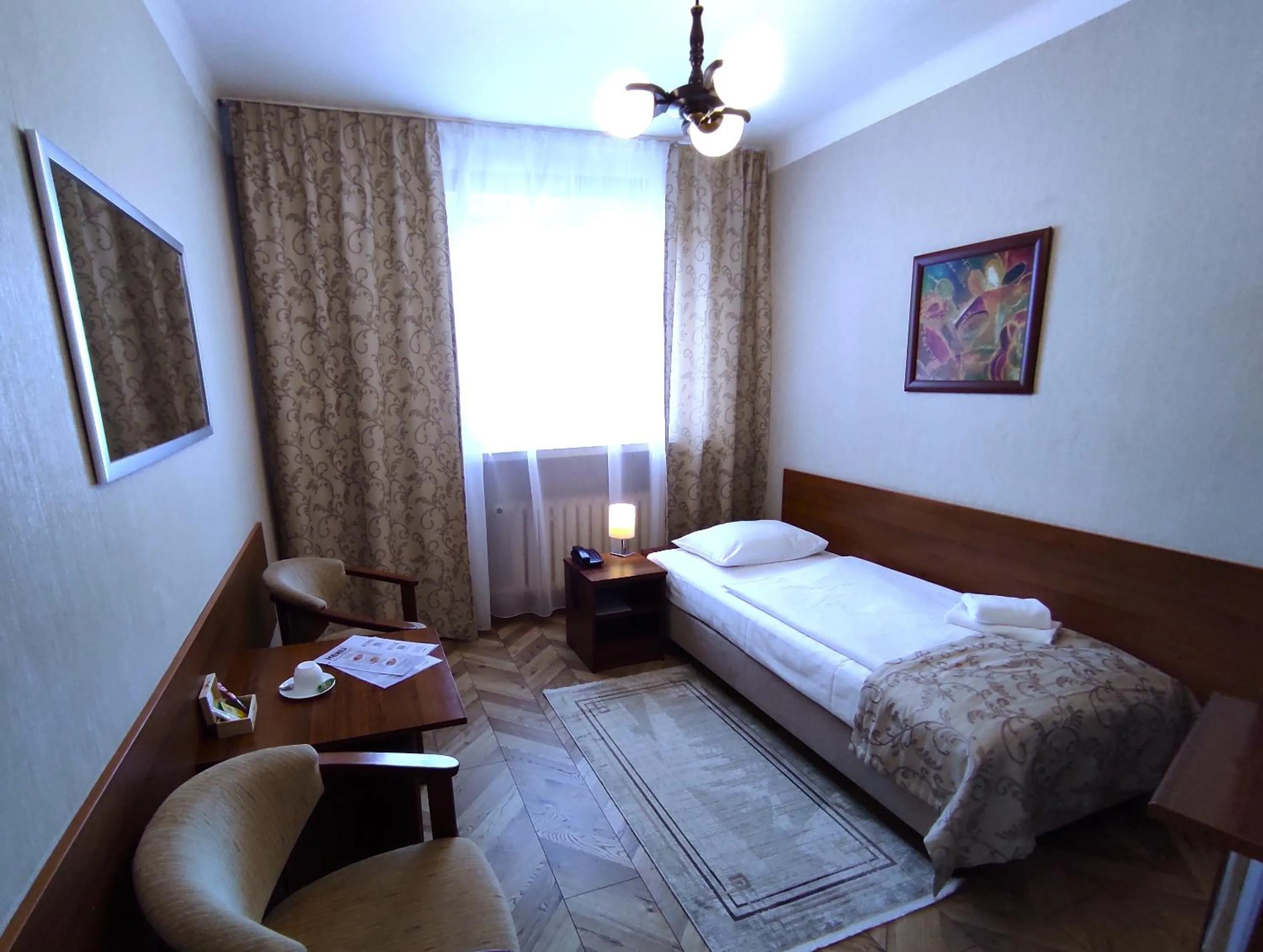 Seating area, Bed in Hotel Polonia