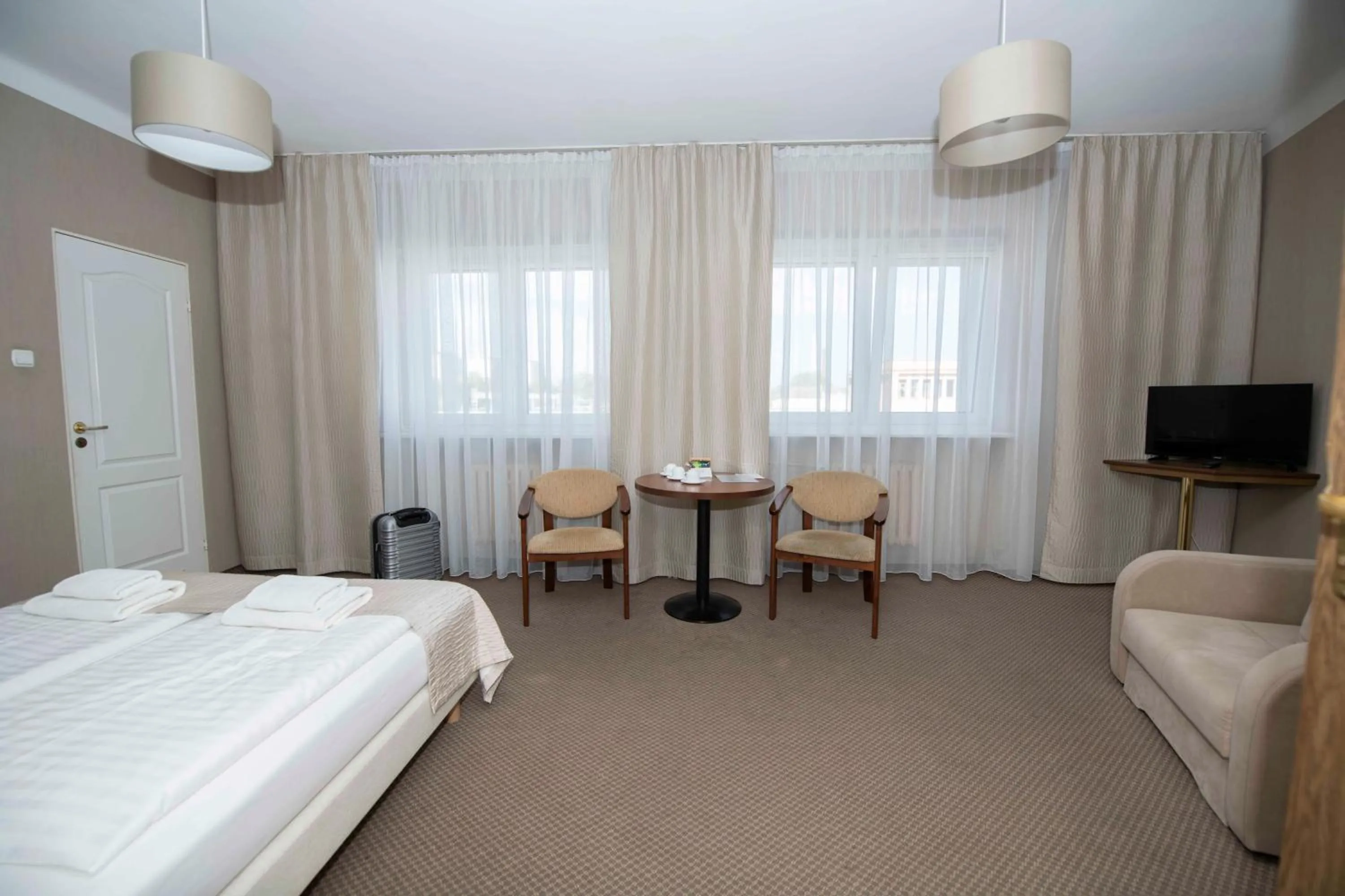 Seating area, Bed in Hotel Polonia