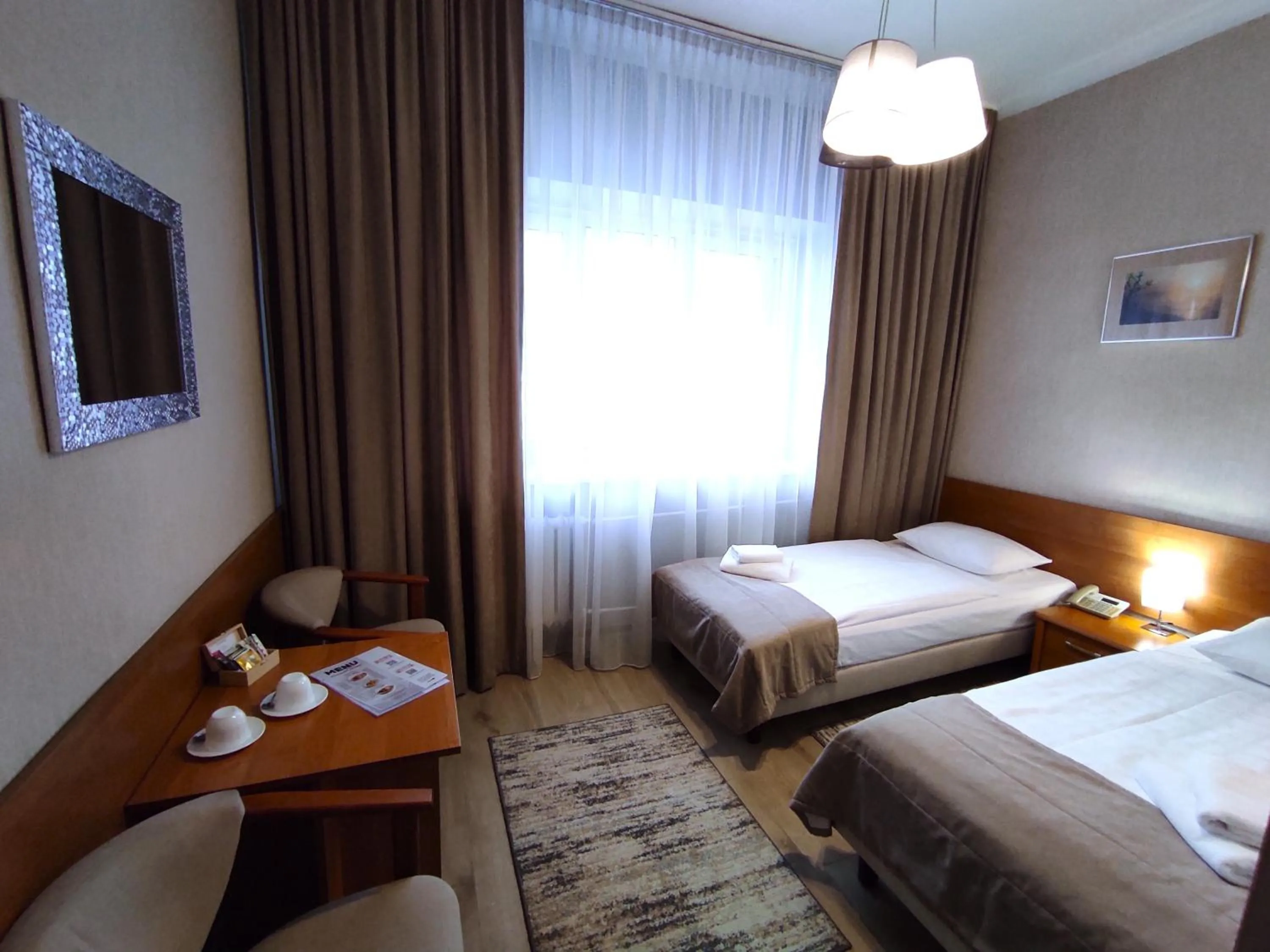 Seating area, Bed in Hotel Polonia