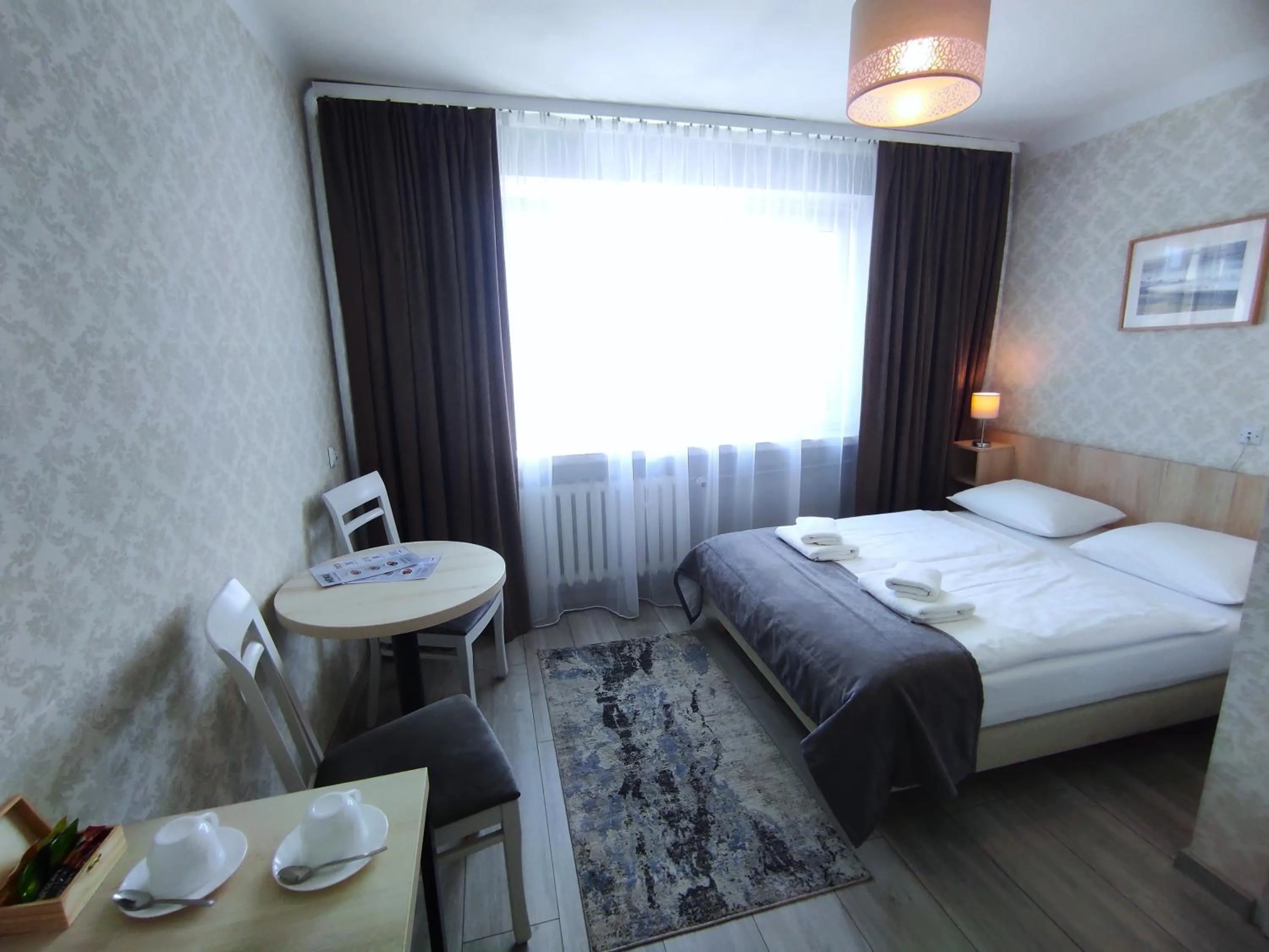 Seating area, Bed in Hotel Polonia