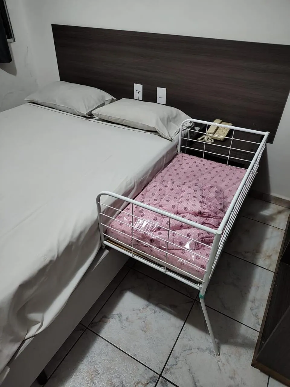 Bed in Center Plaza Hotel