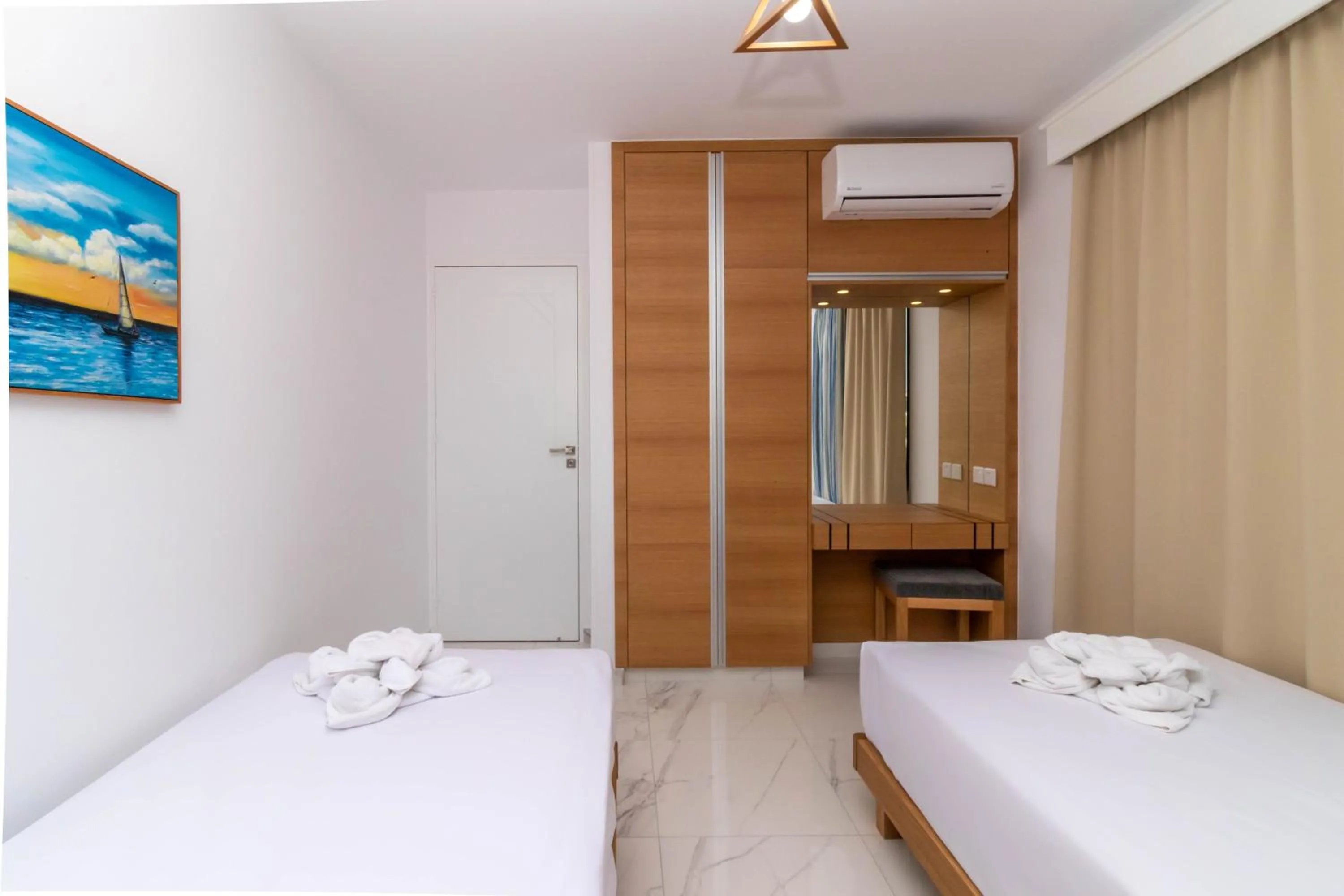 Bed in Rododafni Beach Apartments