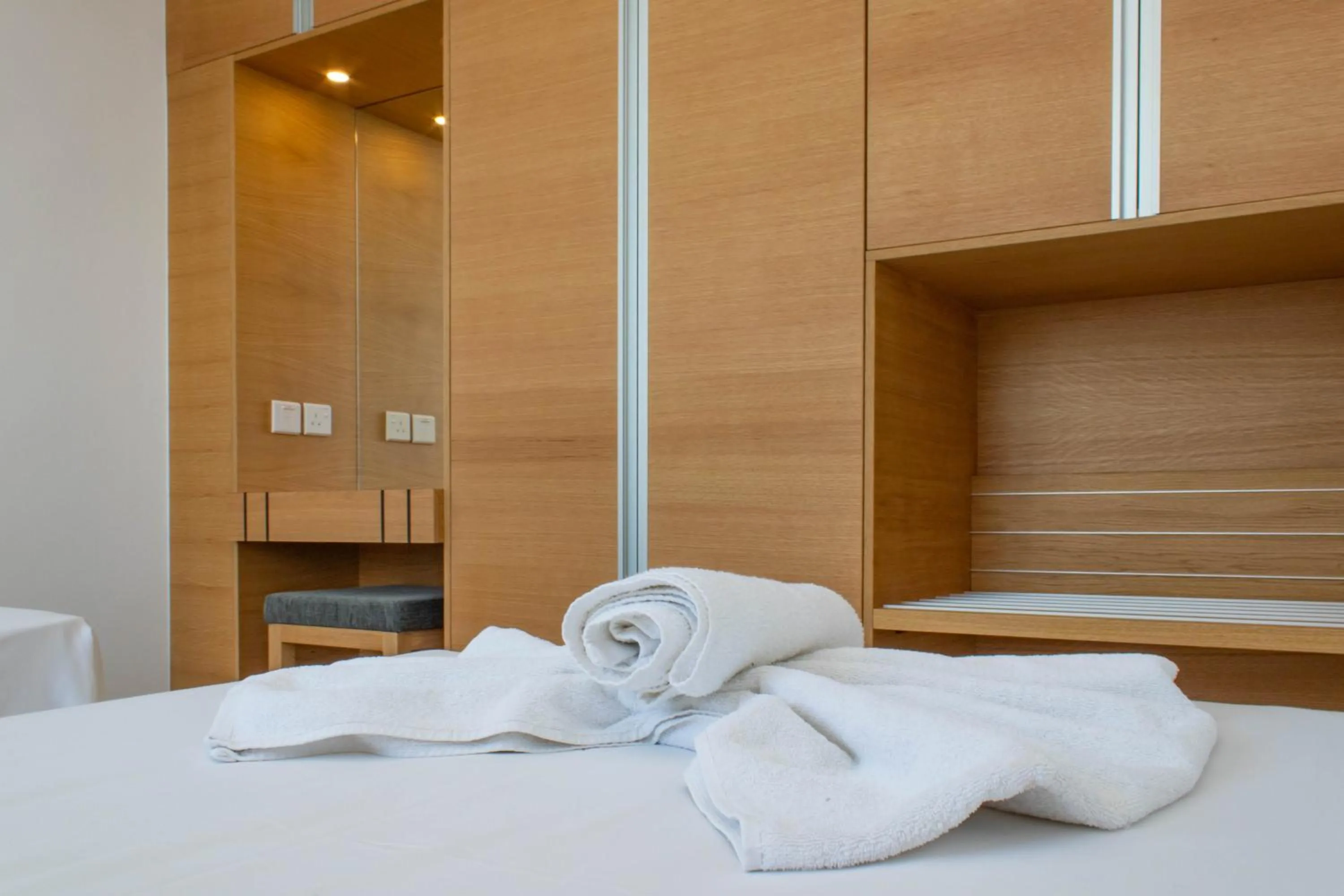 Bed in Rododafni Beach Apartments