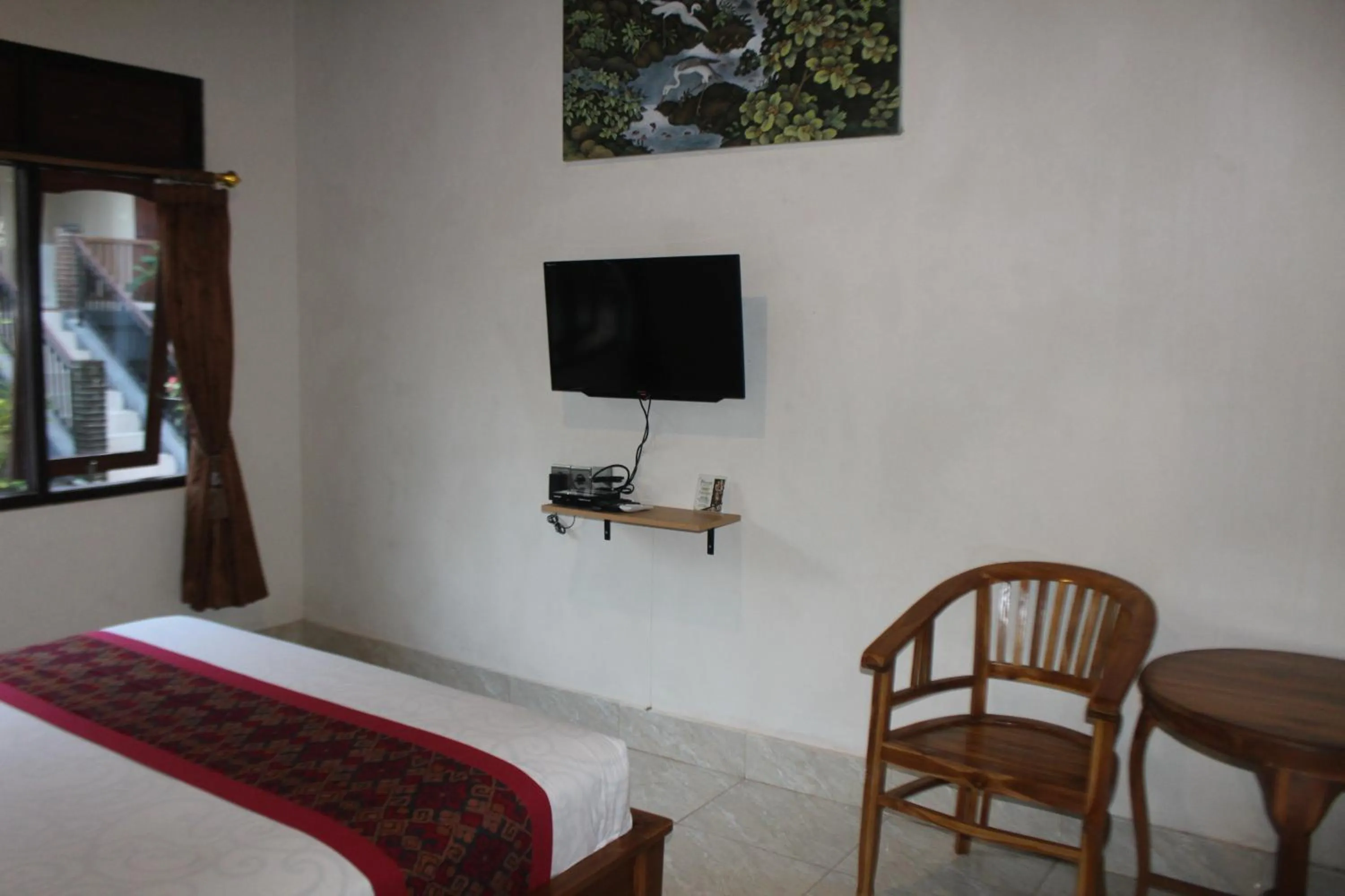 TV and multimedia, Bed in Balimas Guest House