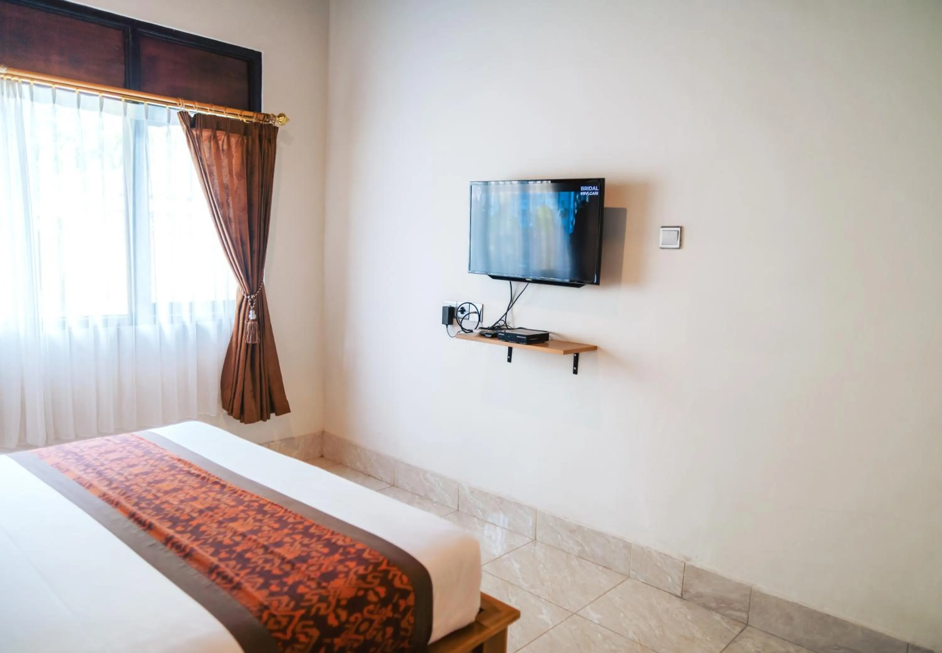 TV and multimedia, Bed in Balimas Guest House