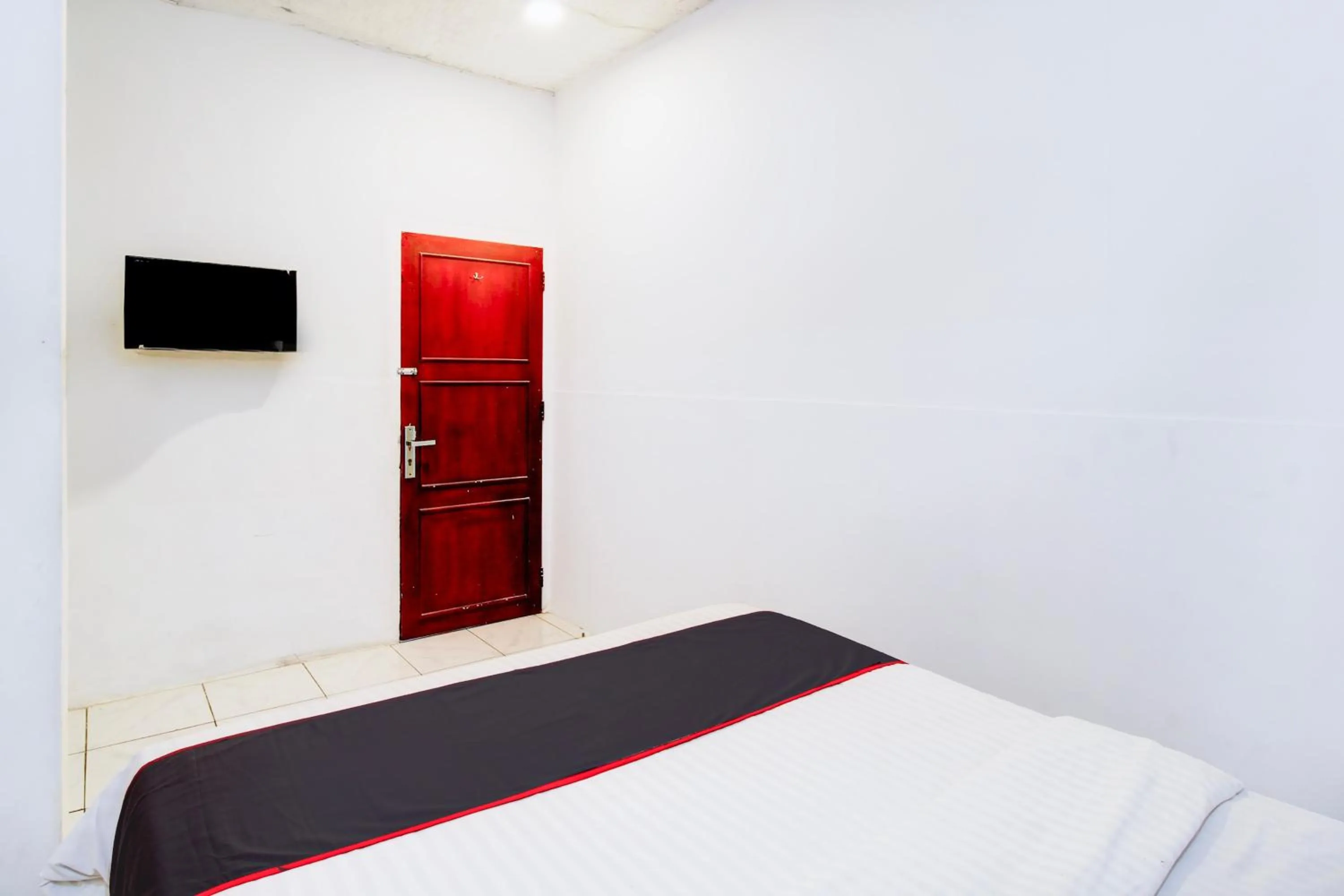 Bedroom, Bed in Hotel O Jalan Jenderal Sudirman Near Imam Bonjol Square Formerly Nelvi Guest House