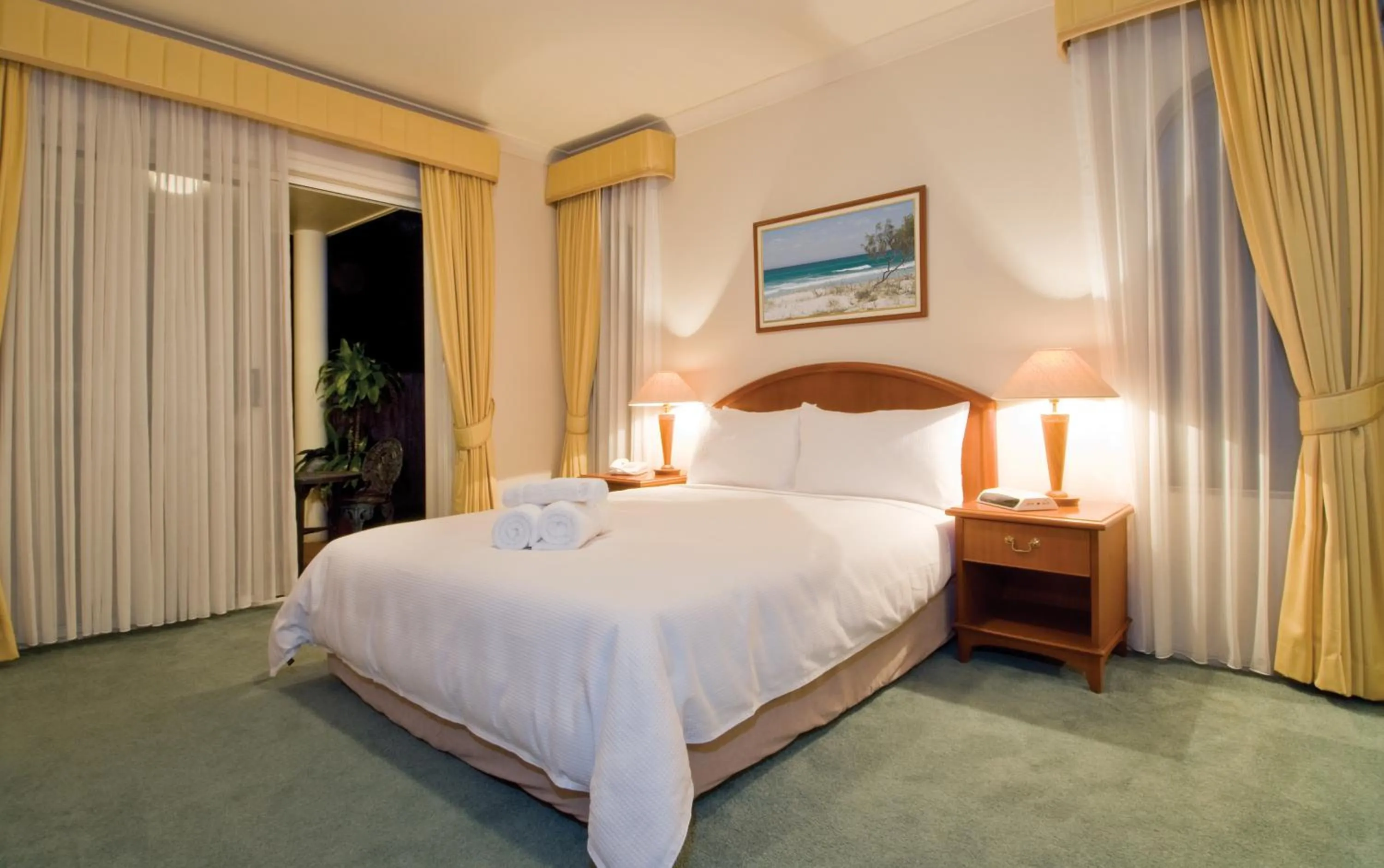 Bed in Royal Woods Resort