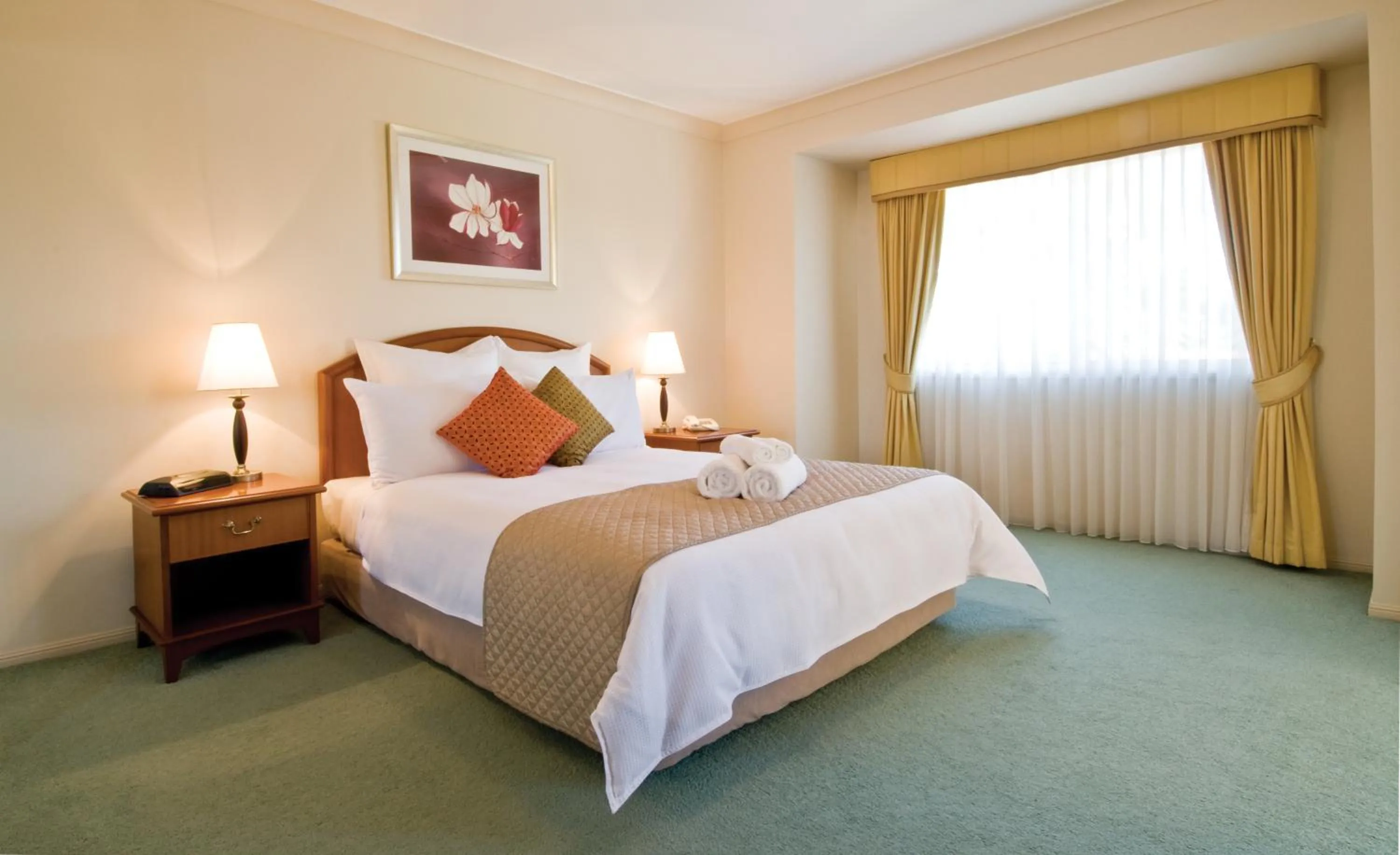 Bed in Royal Woods Resort