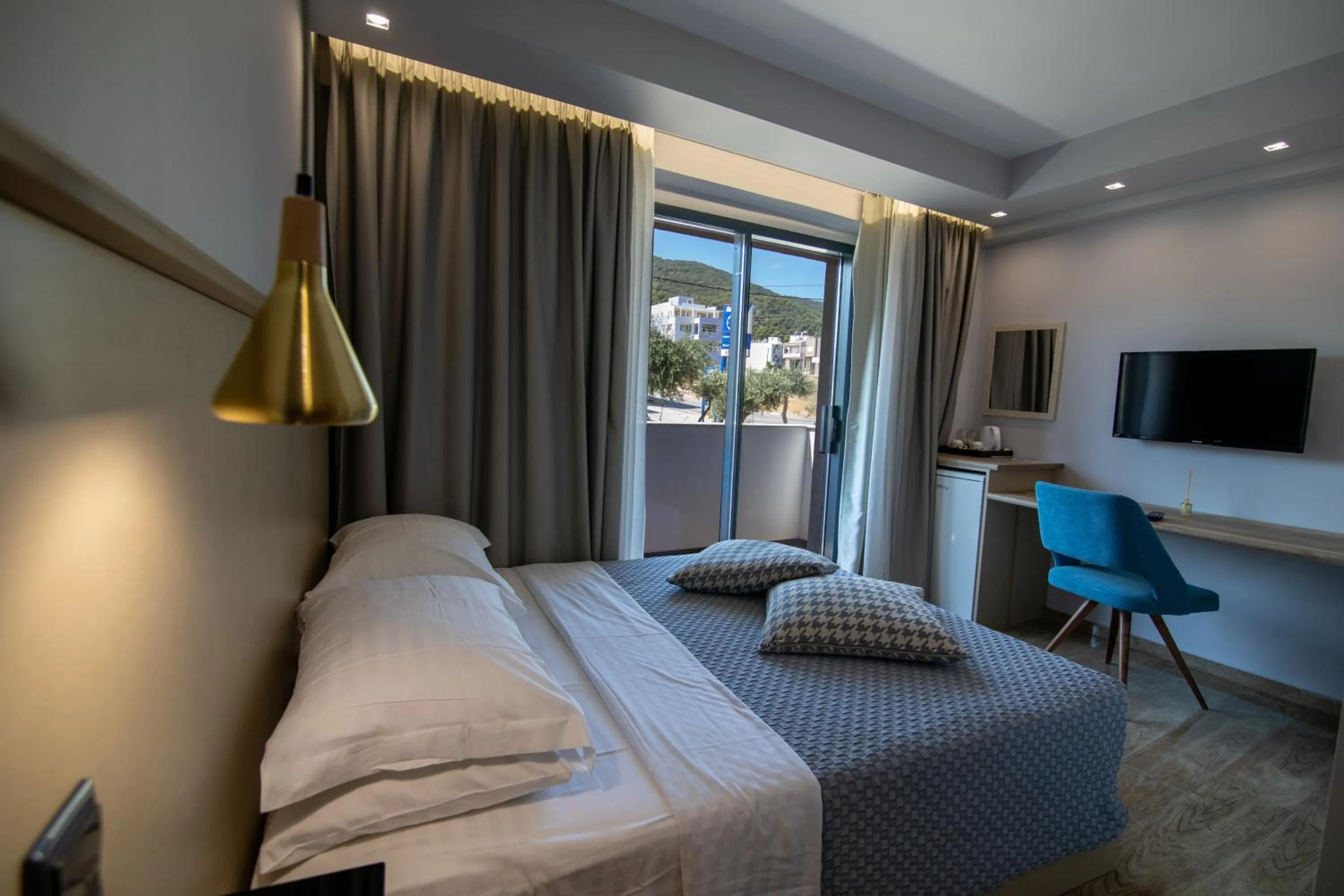 Bed in Aianteion Bay Luxury Hotel & Suites