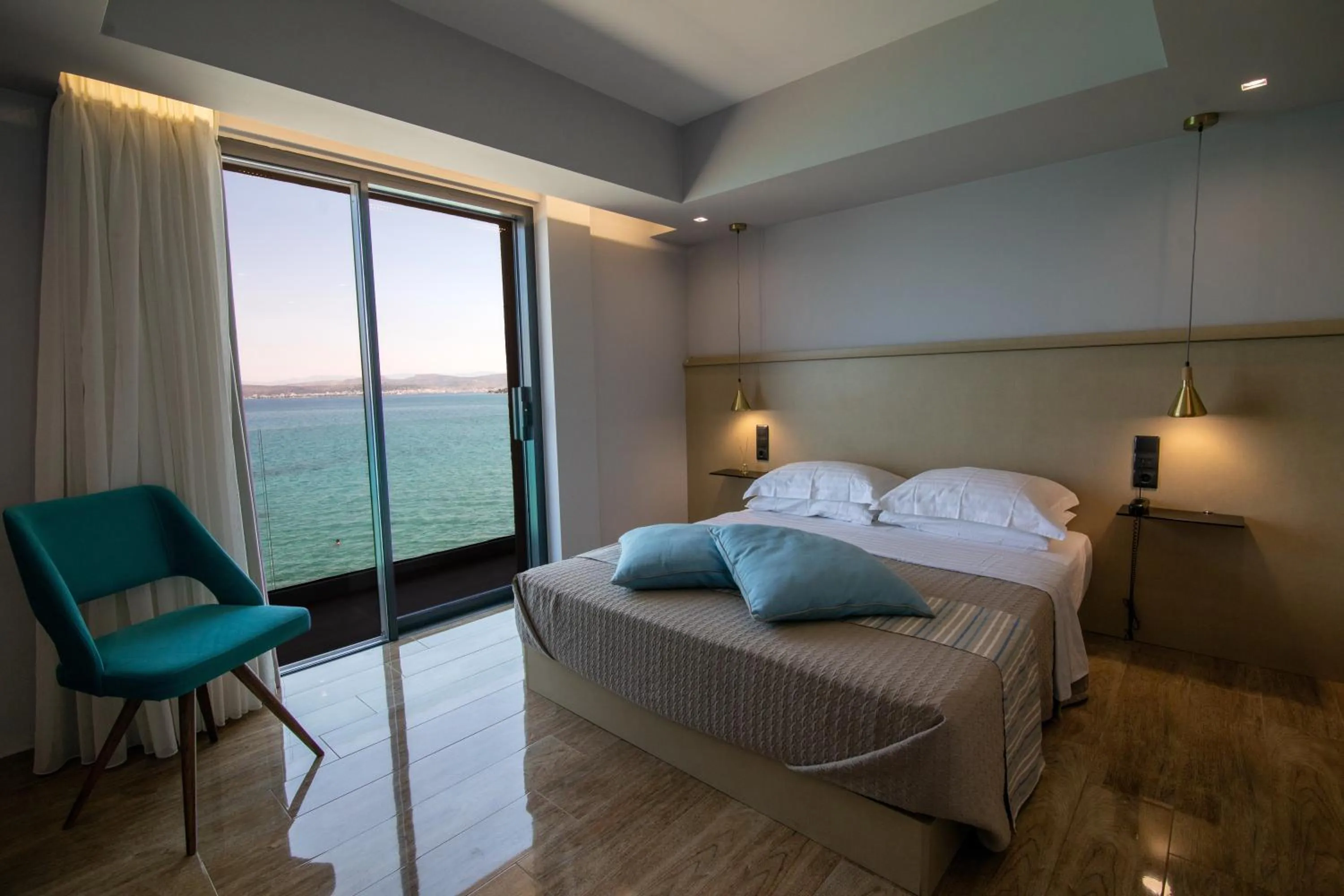 Bed in Aianteion Bay Luxury Hotel & Suites