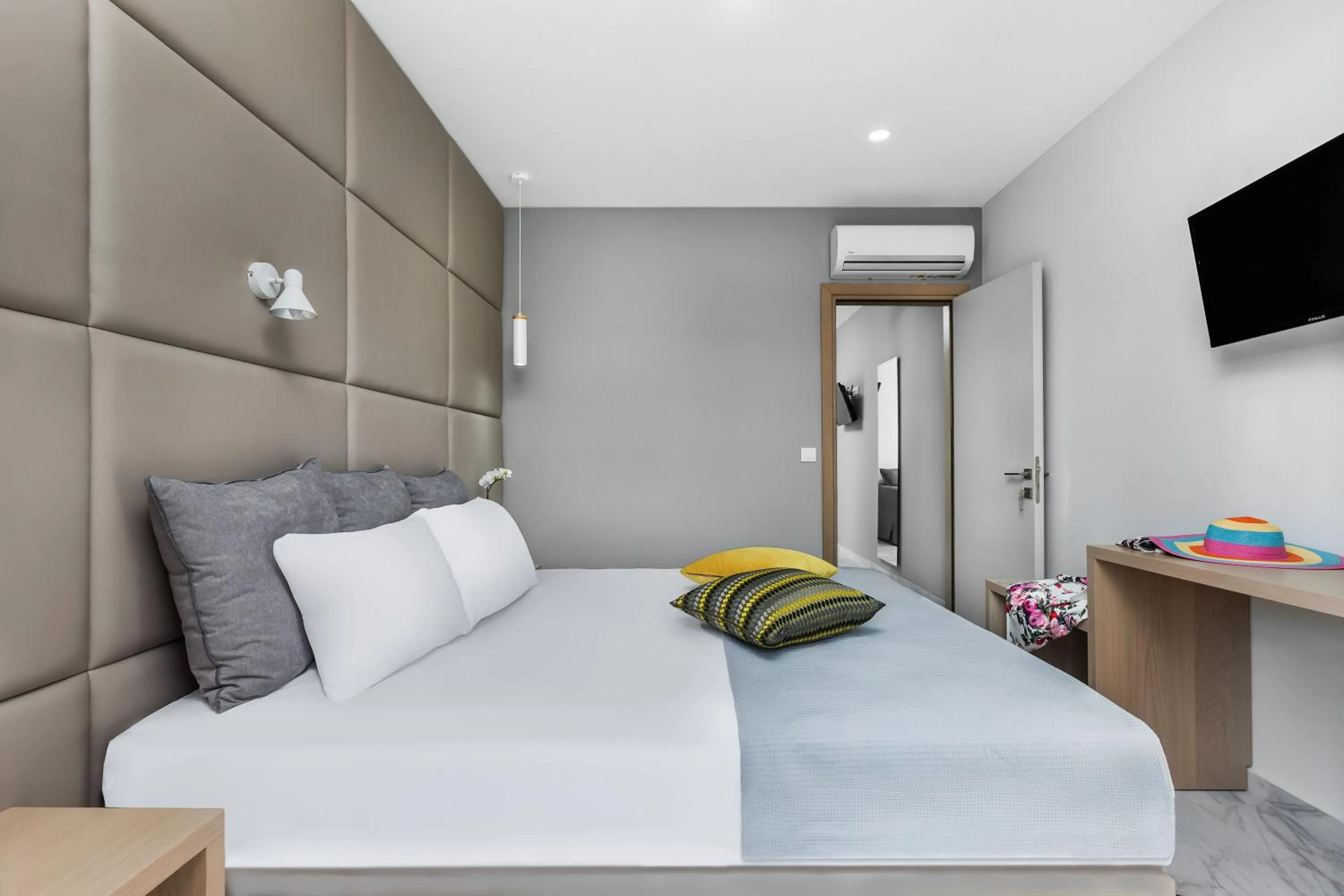 Bed in Nymphes Deluxe Accommodation Pefkochori