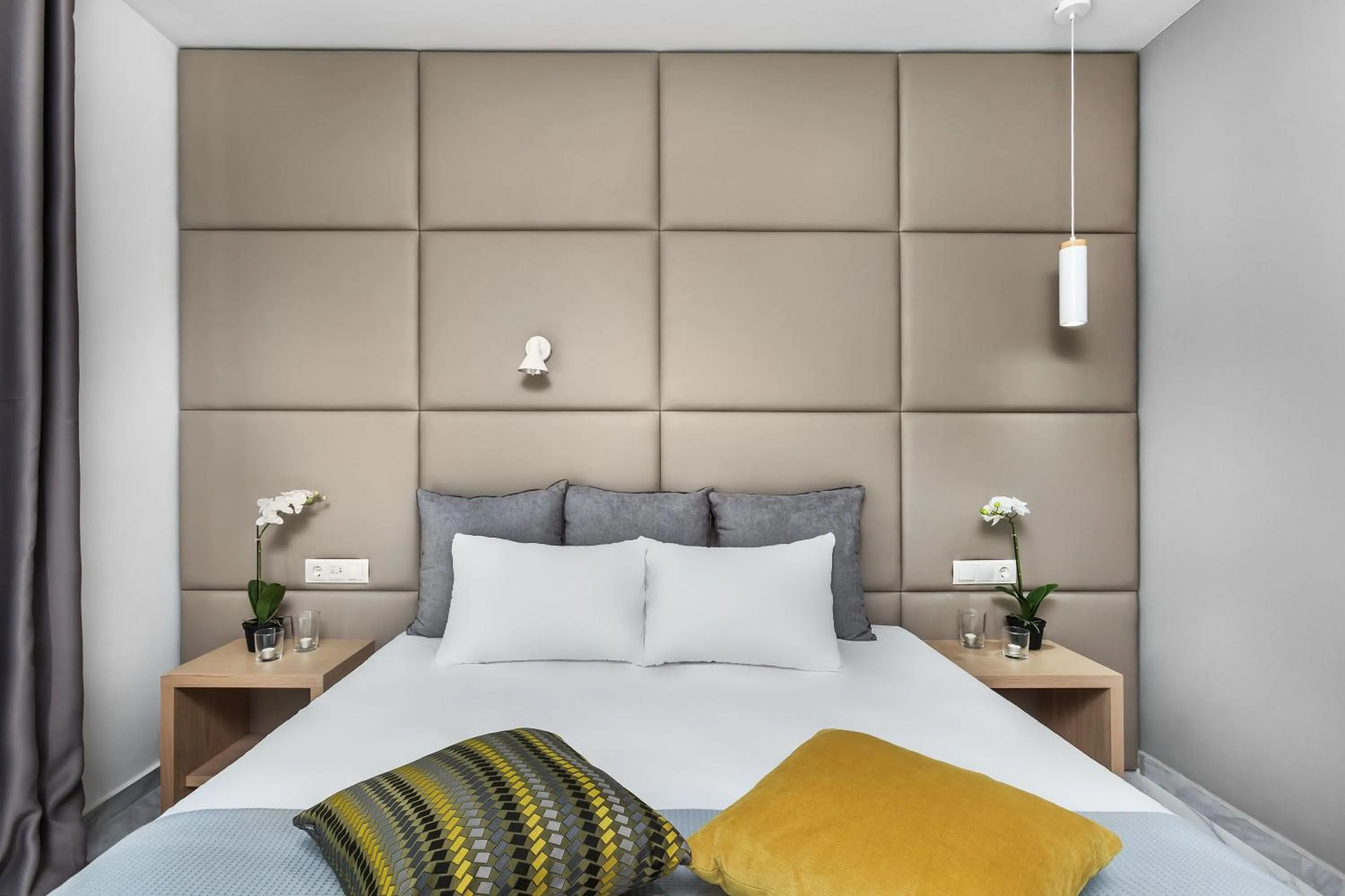 Bed in Nymphes Deluxe Accommodation Pefkochori