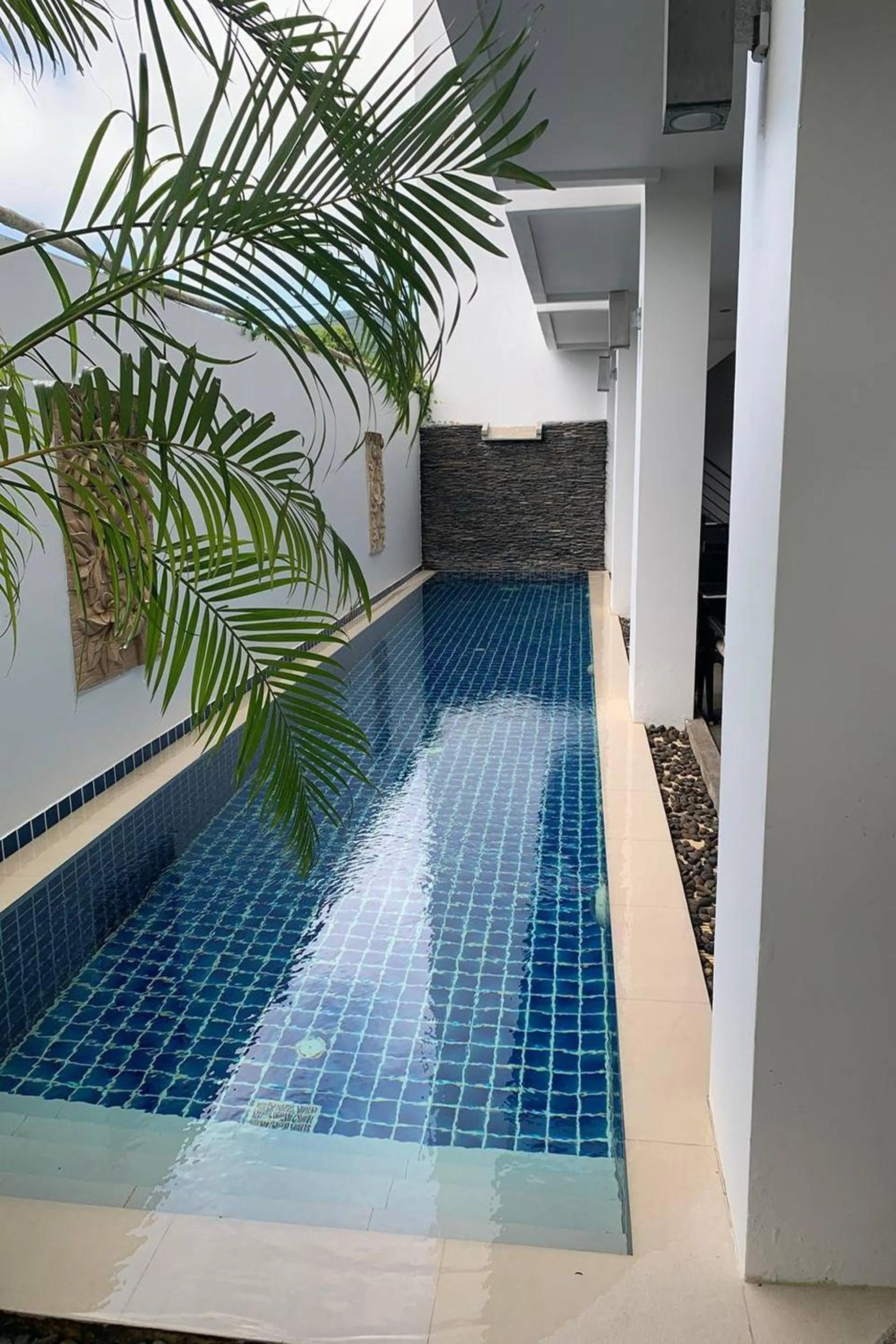 Pool view in One World One Home Naiharn Hotel