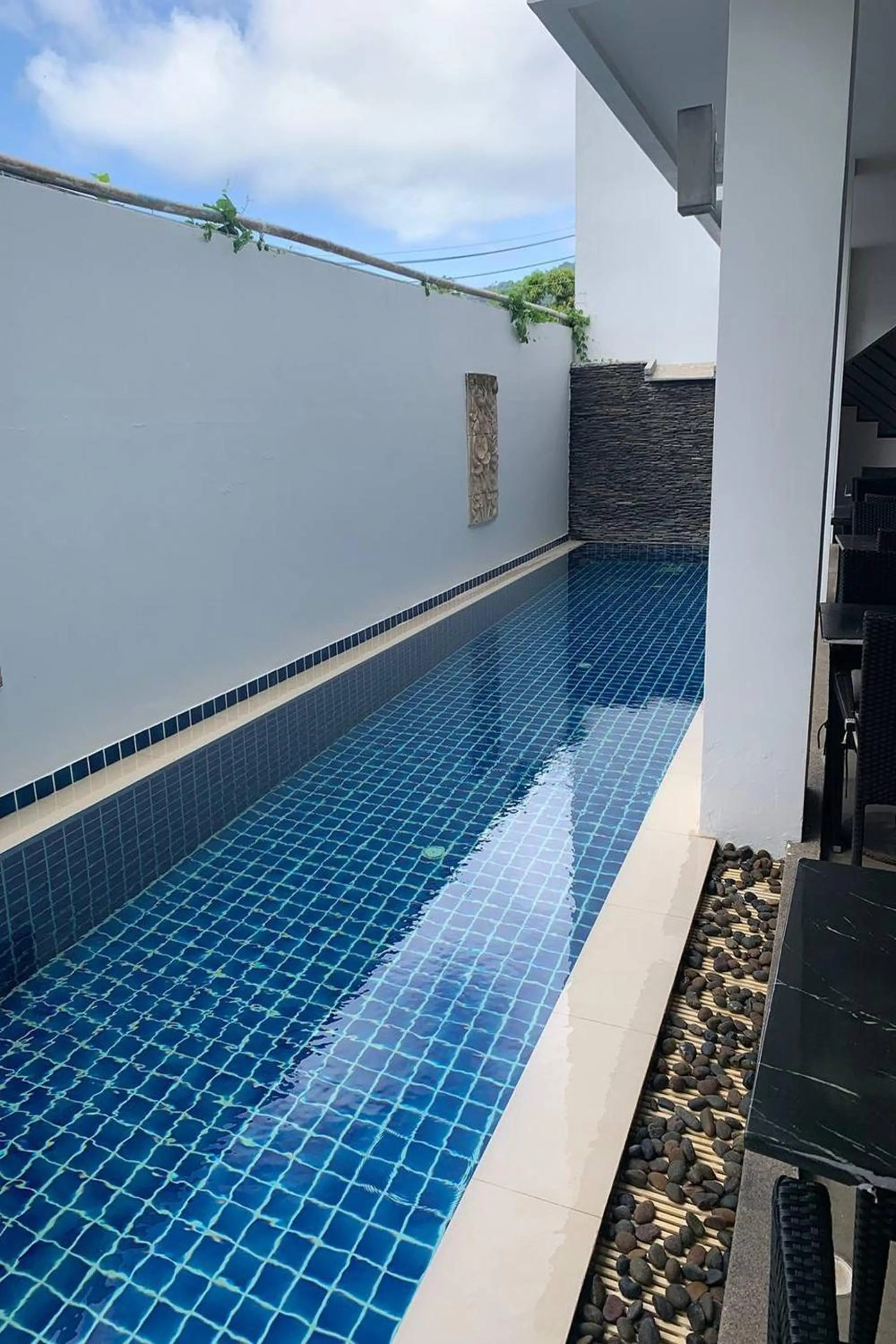 Pool view in One World One Home Naiharn Hotel