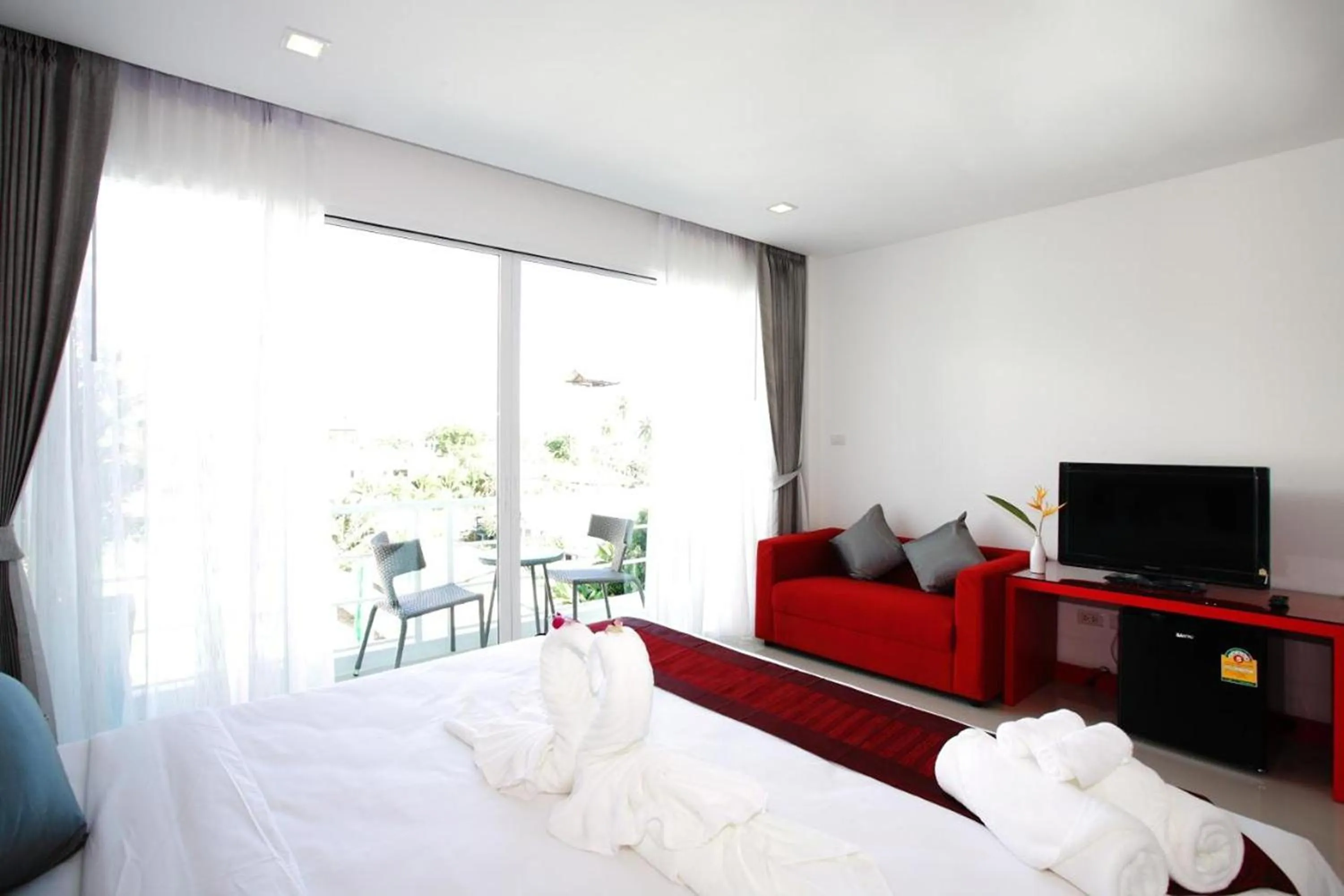 Bed in One World One Home Naiharn Hotel