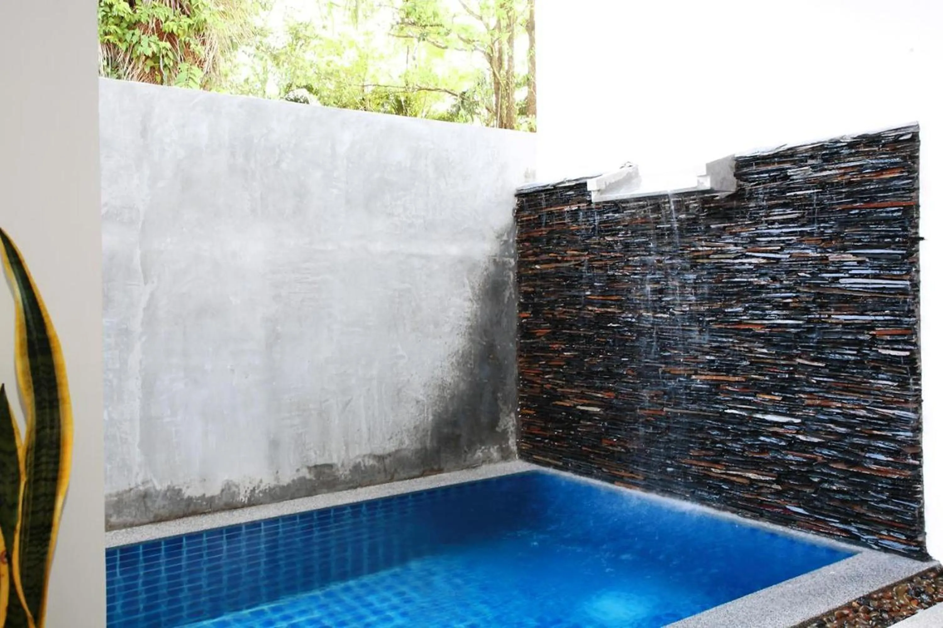 Swimming pool in One World One Home Naiharn Hotel