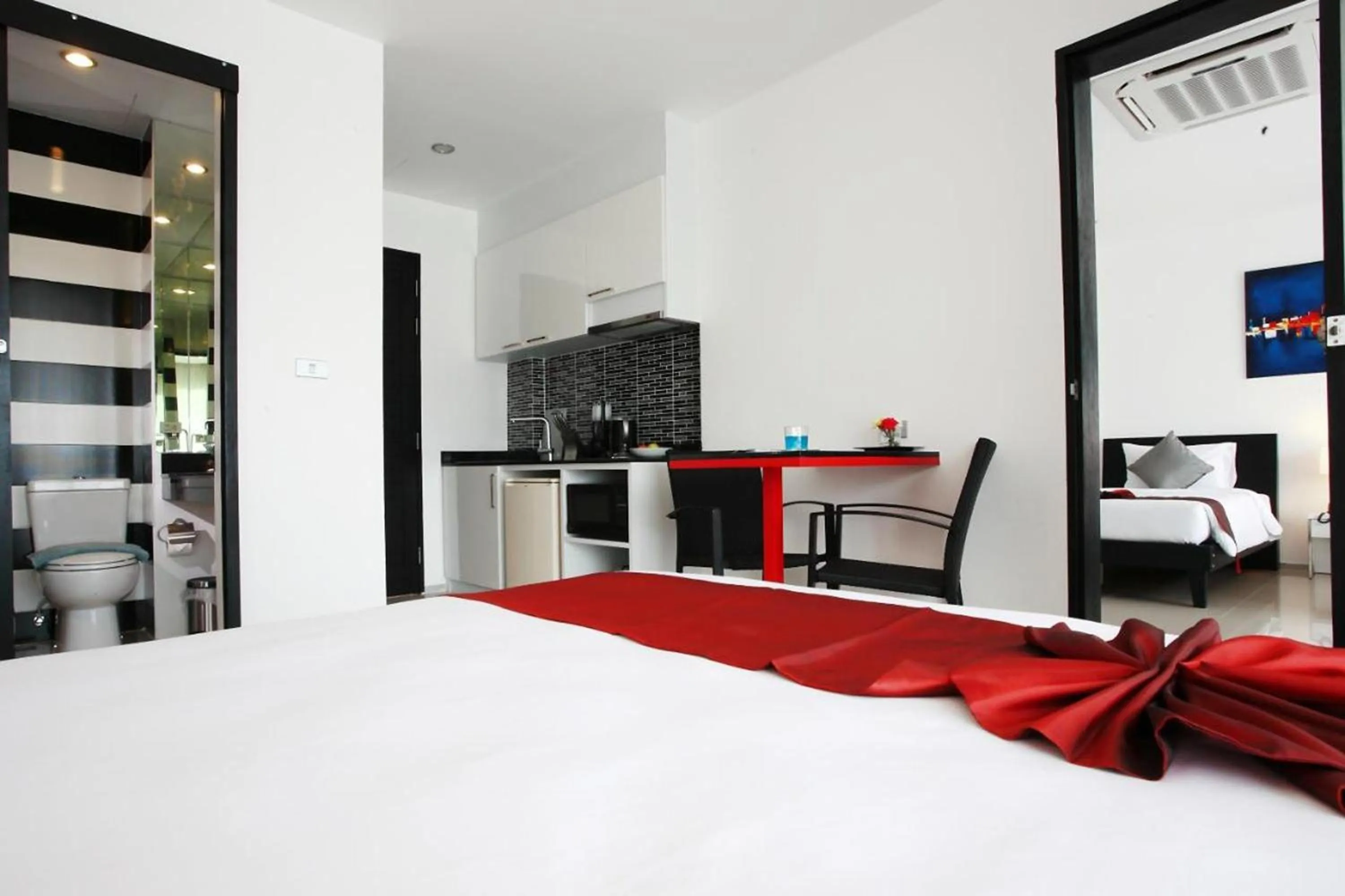 Bed in One World One Home Naiharn Hotel