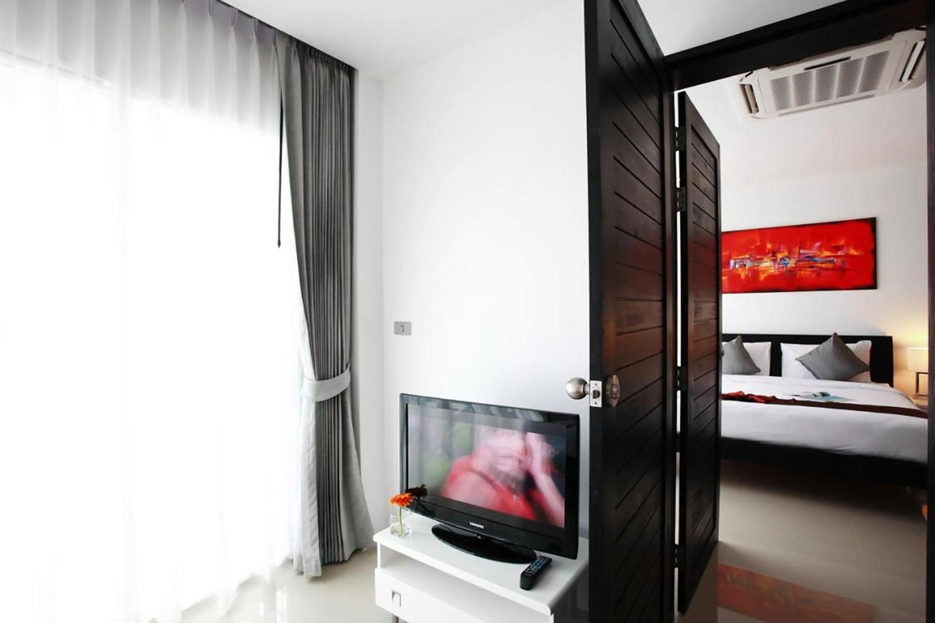 Bed in One World One Home Naiharn Hotel