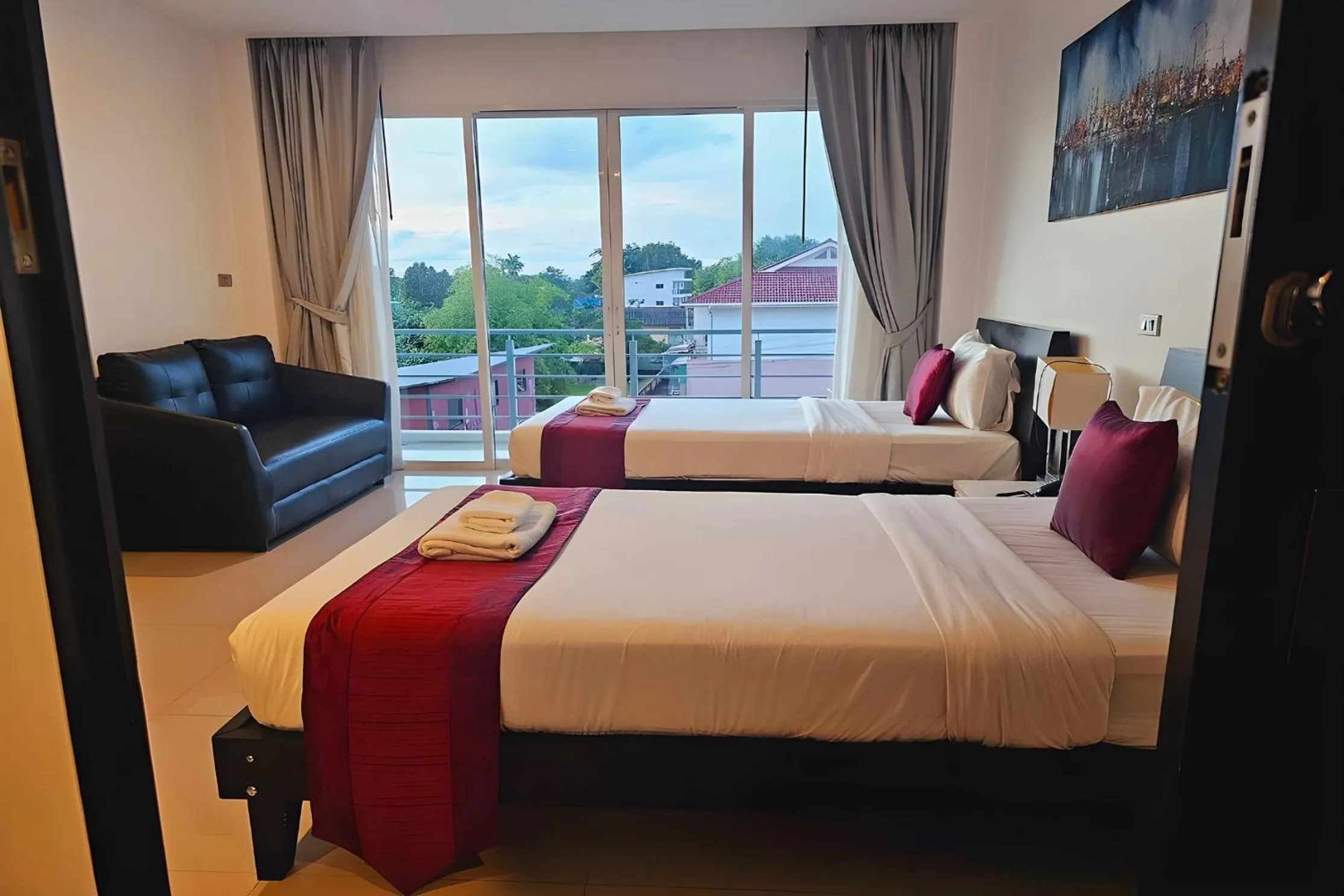 Bed in One World One Home Naiharn Hotel