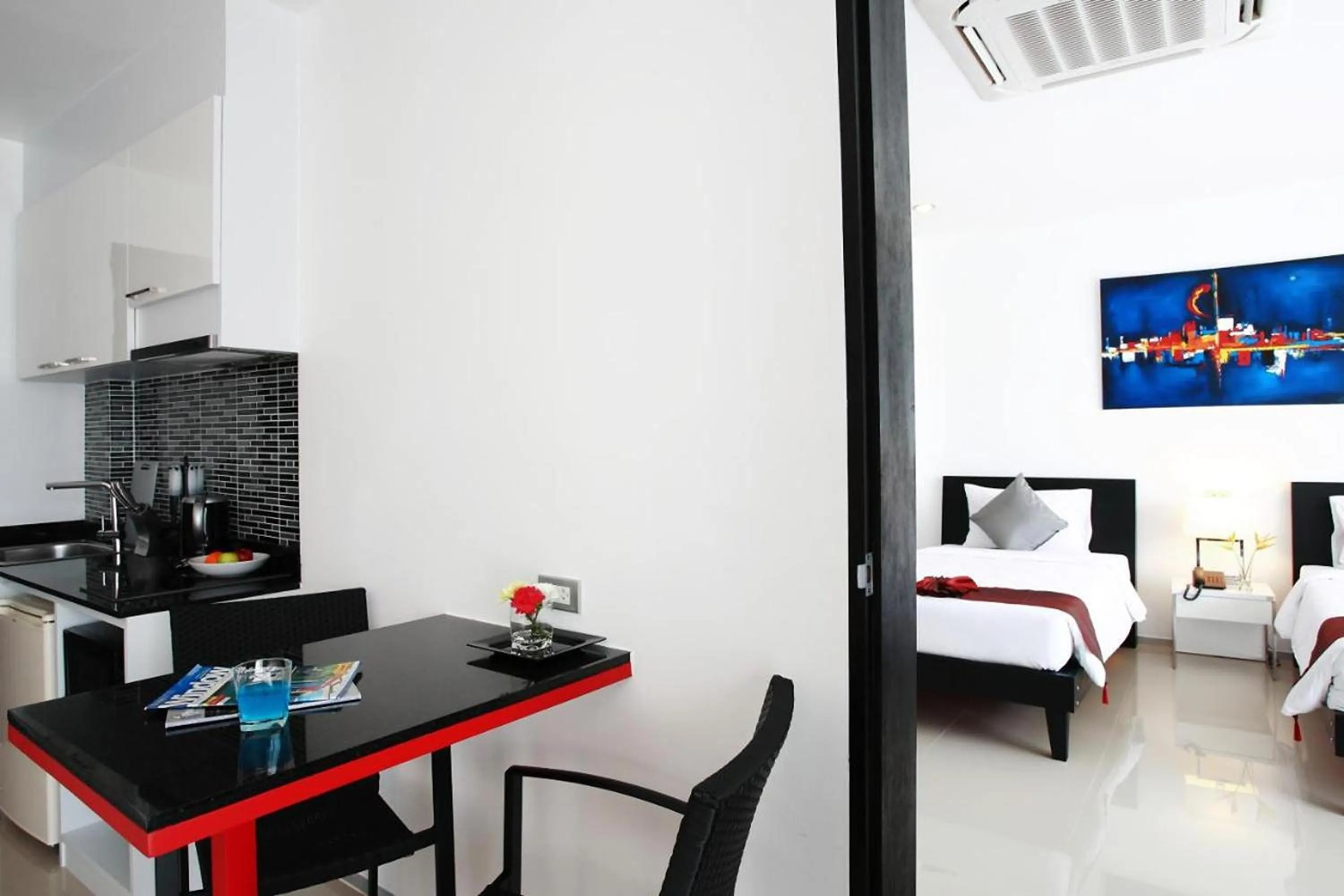 Bed in One World One Home Naiharn Hotel