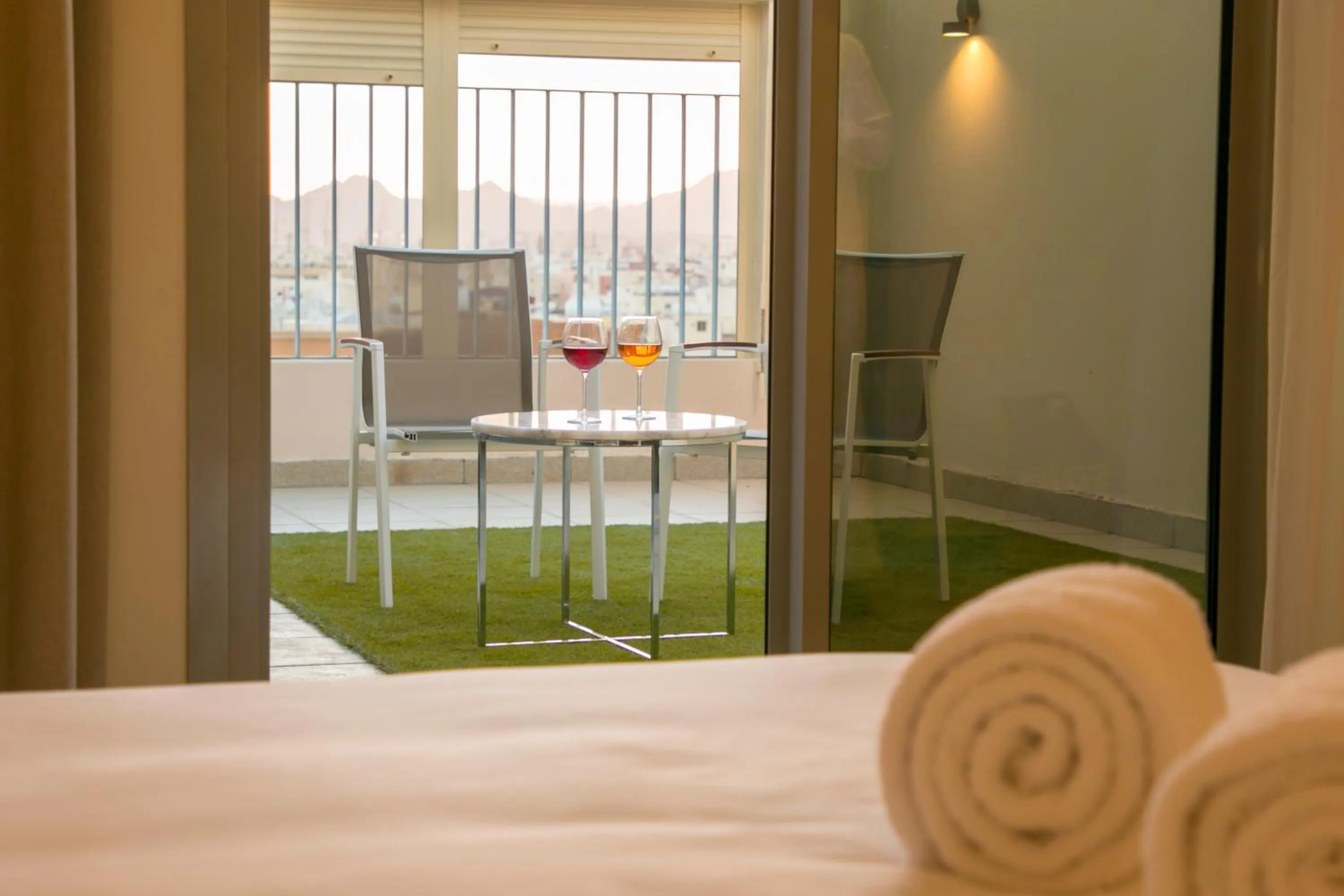 Seating area, Bed in Hafawah Suites