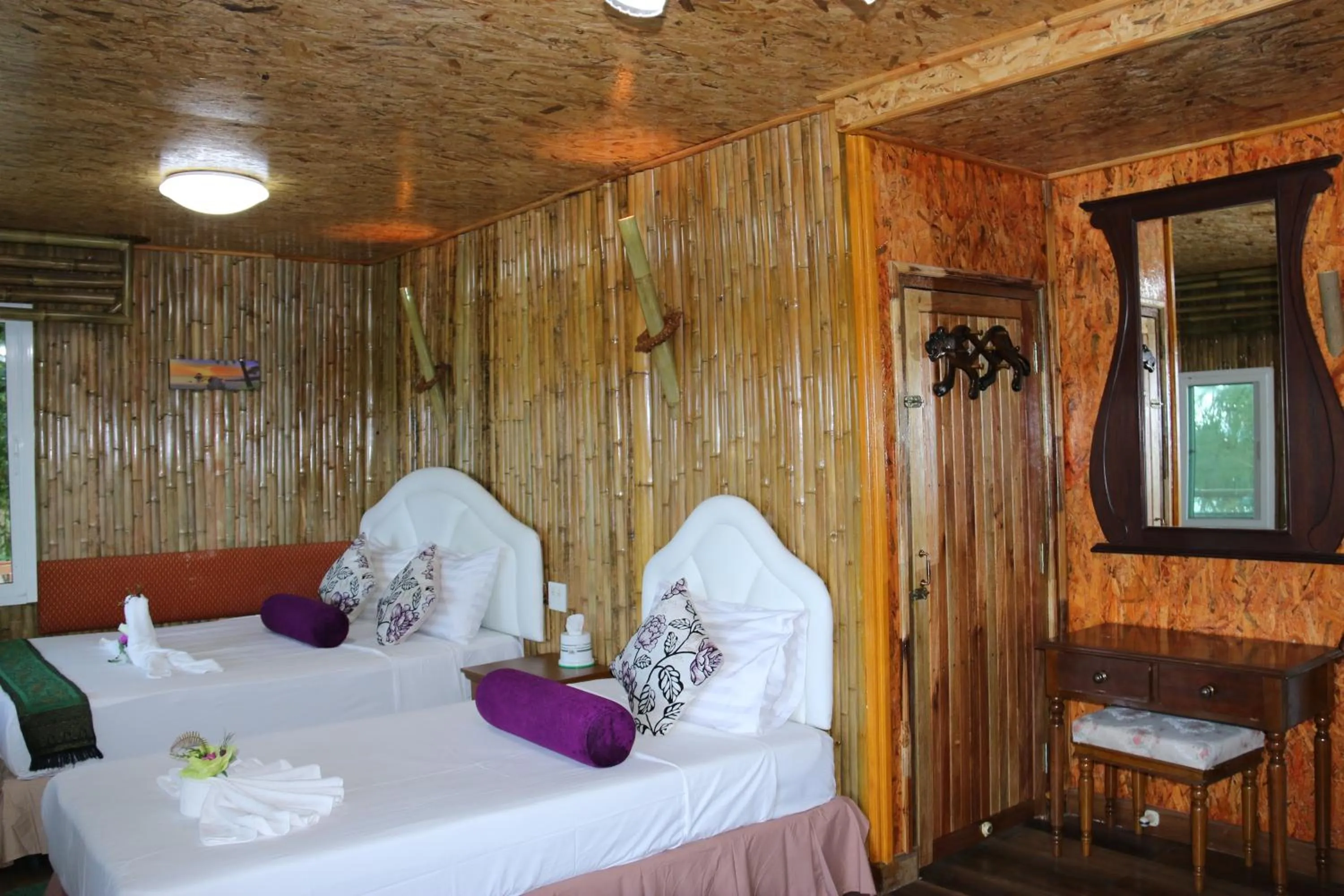 Bed in Ruan Mai Naiyang Beach Resort