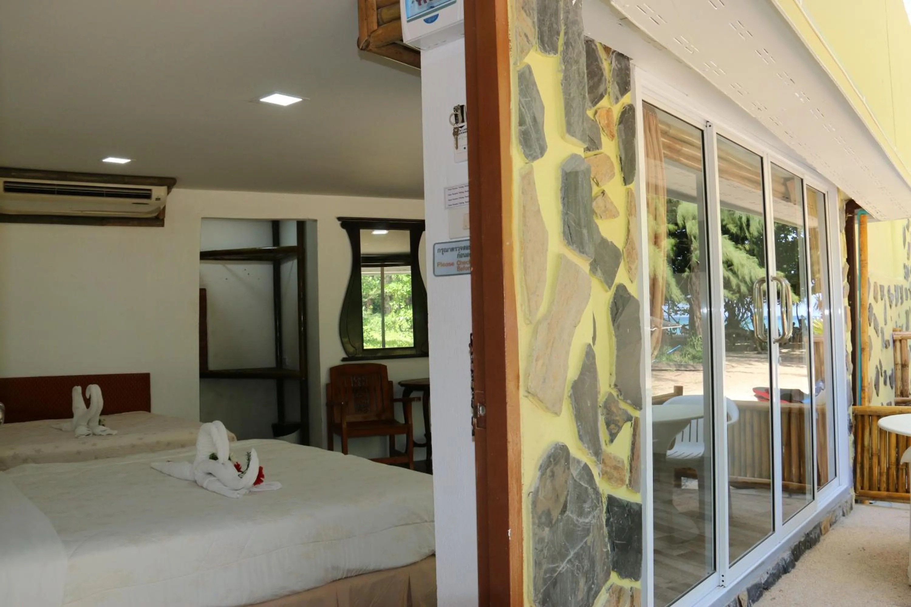 Bed in Ruan Mai Naiyang Beach Resort