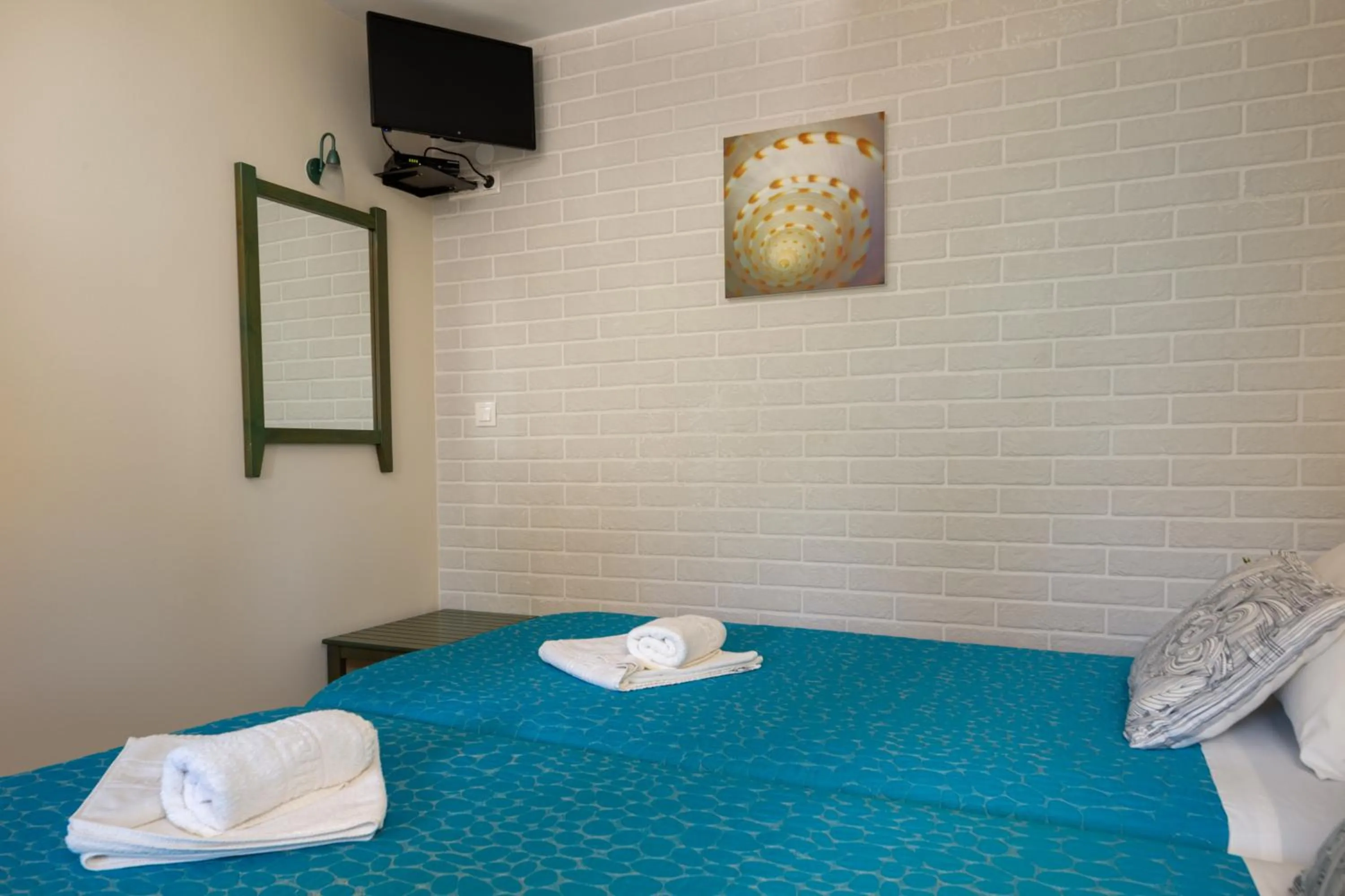 Bed in Armonia Apartments