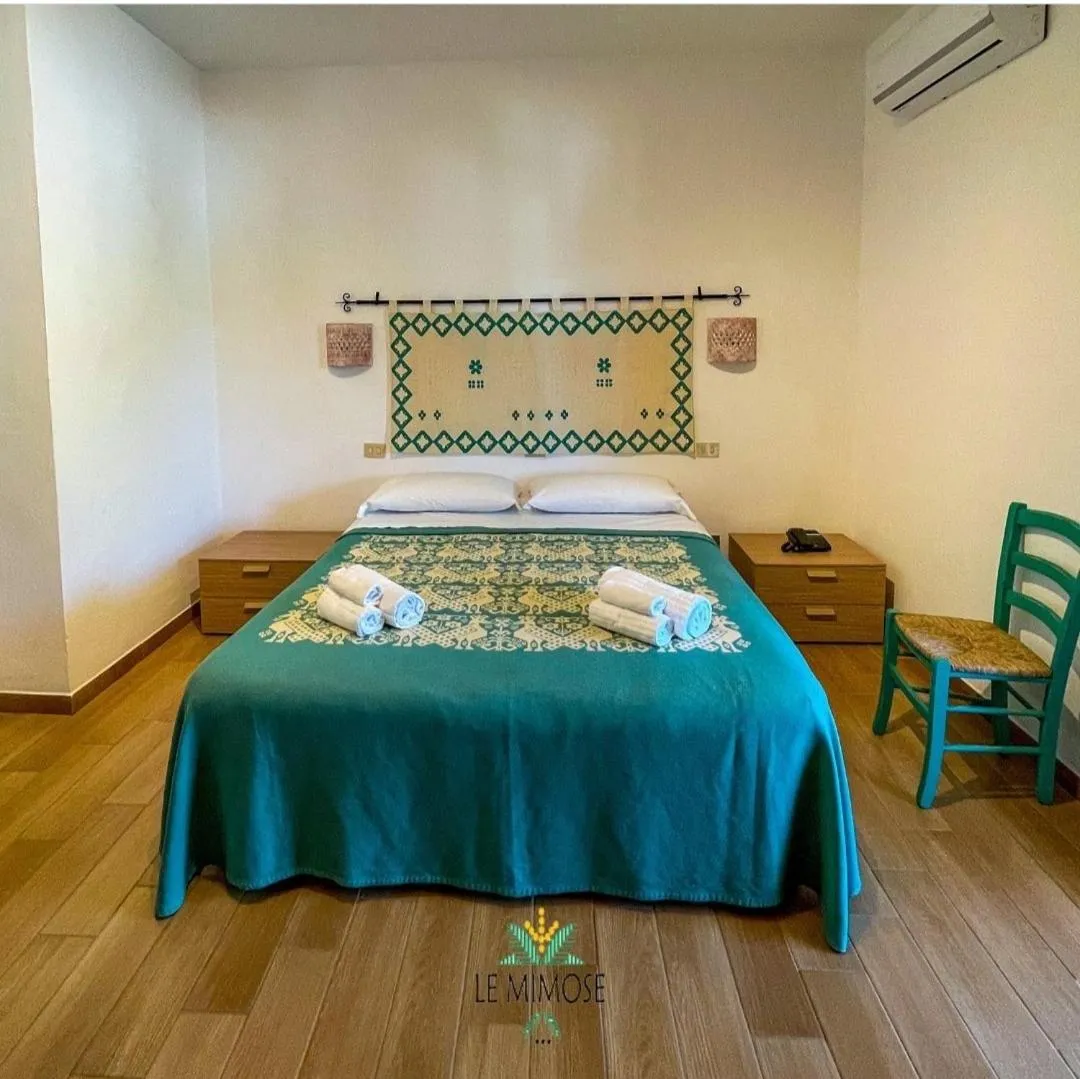 Bed in Hotel Le Mimose