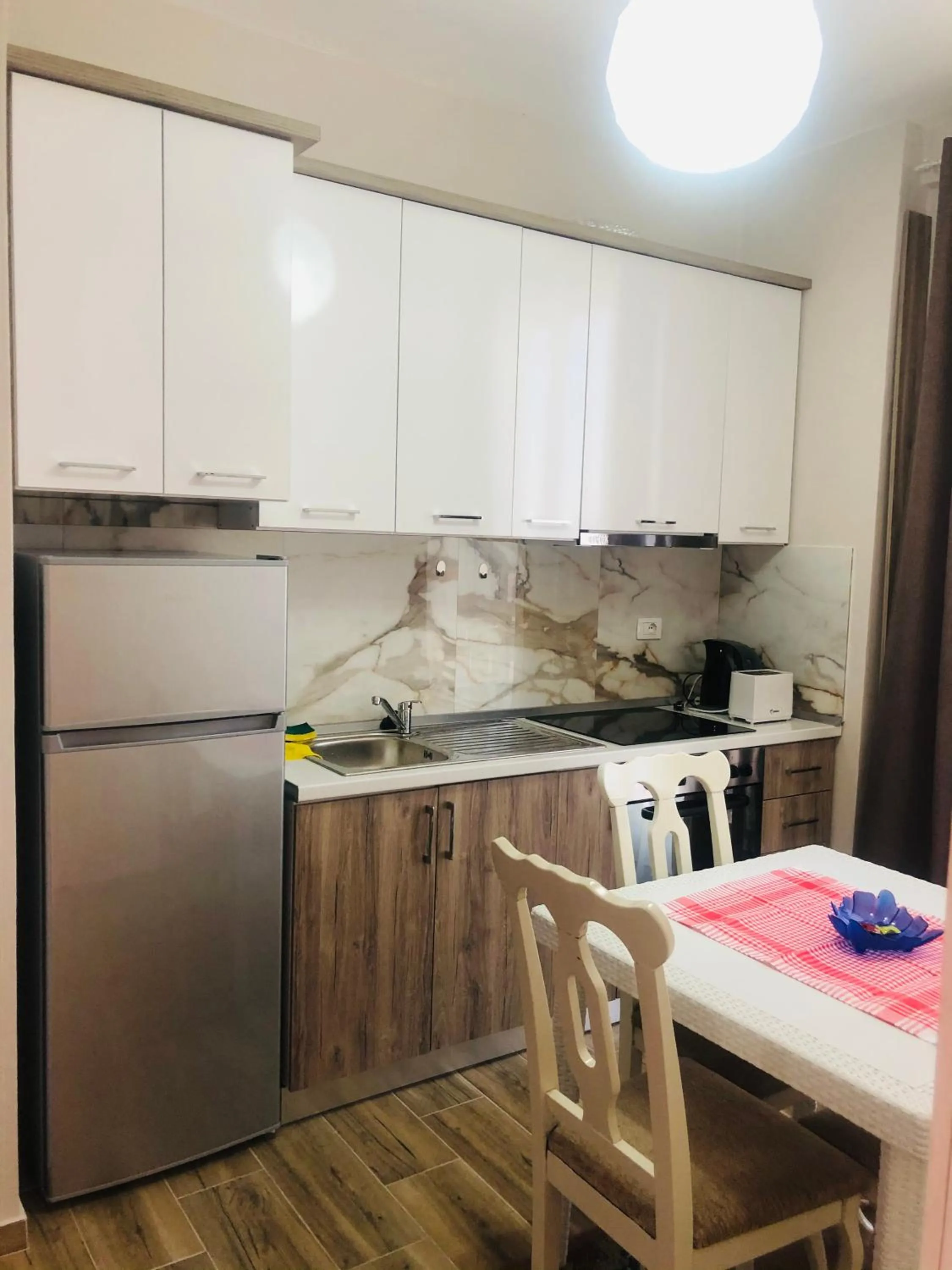 Kitchen or kitchenette in Rezidenca SHOPI Apartments