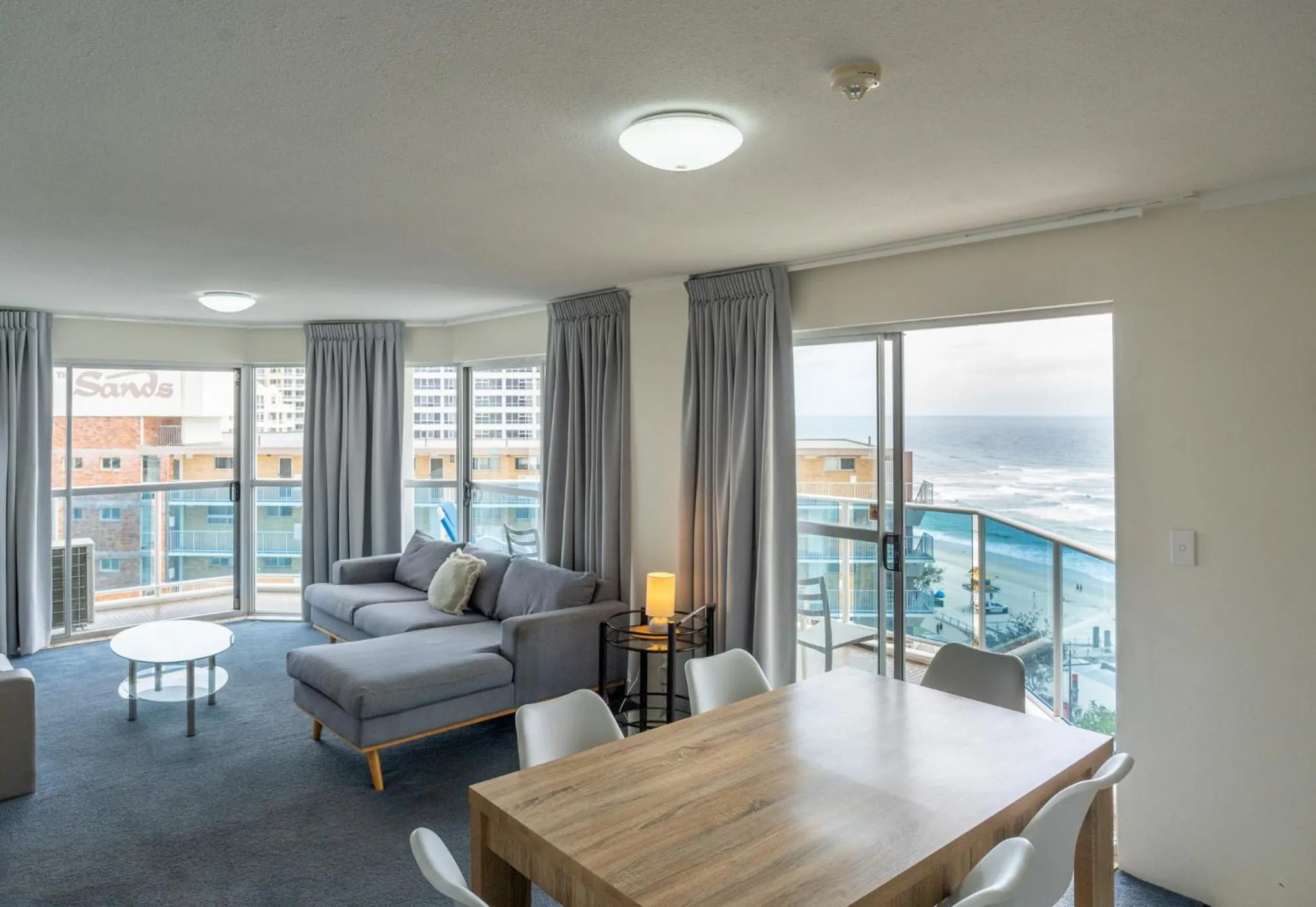 Living room, Bed in Grosvenor Beachfront Apartments Surfers Paradise