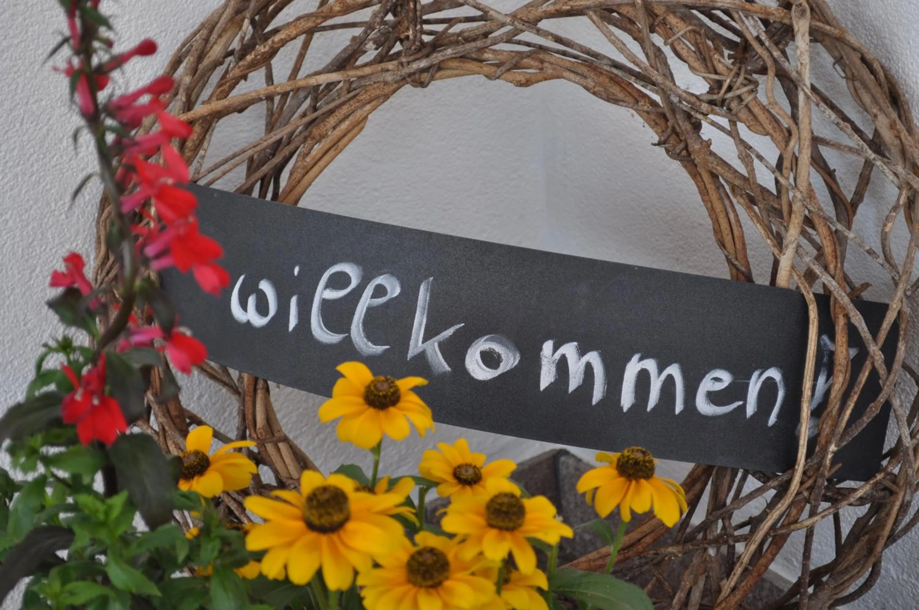 Property logo or sign in Small Hotel Sonne