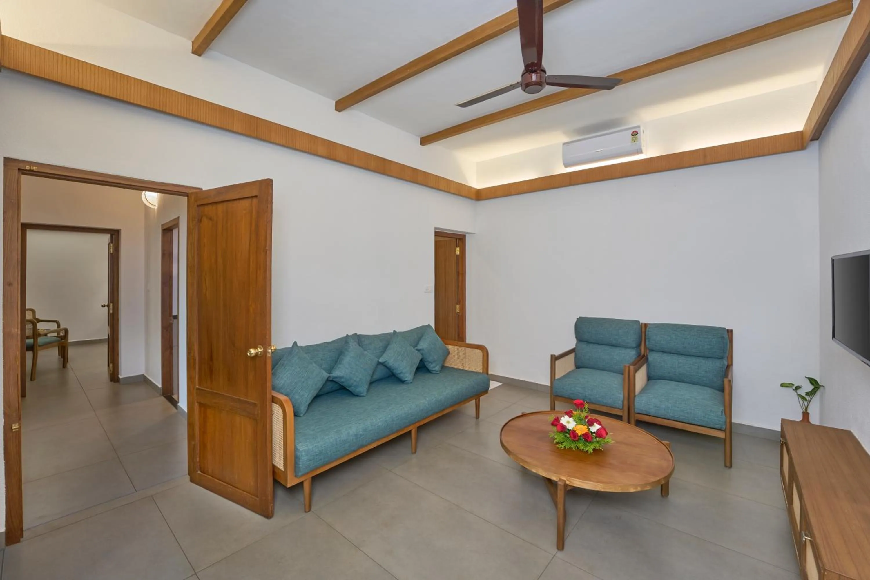 Living room in Cardamom County by Xandari