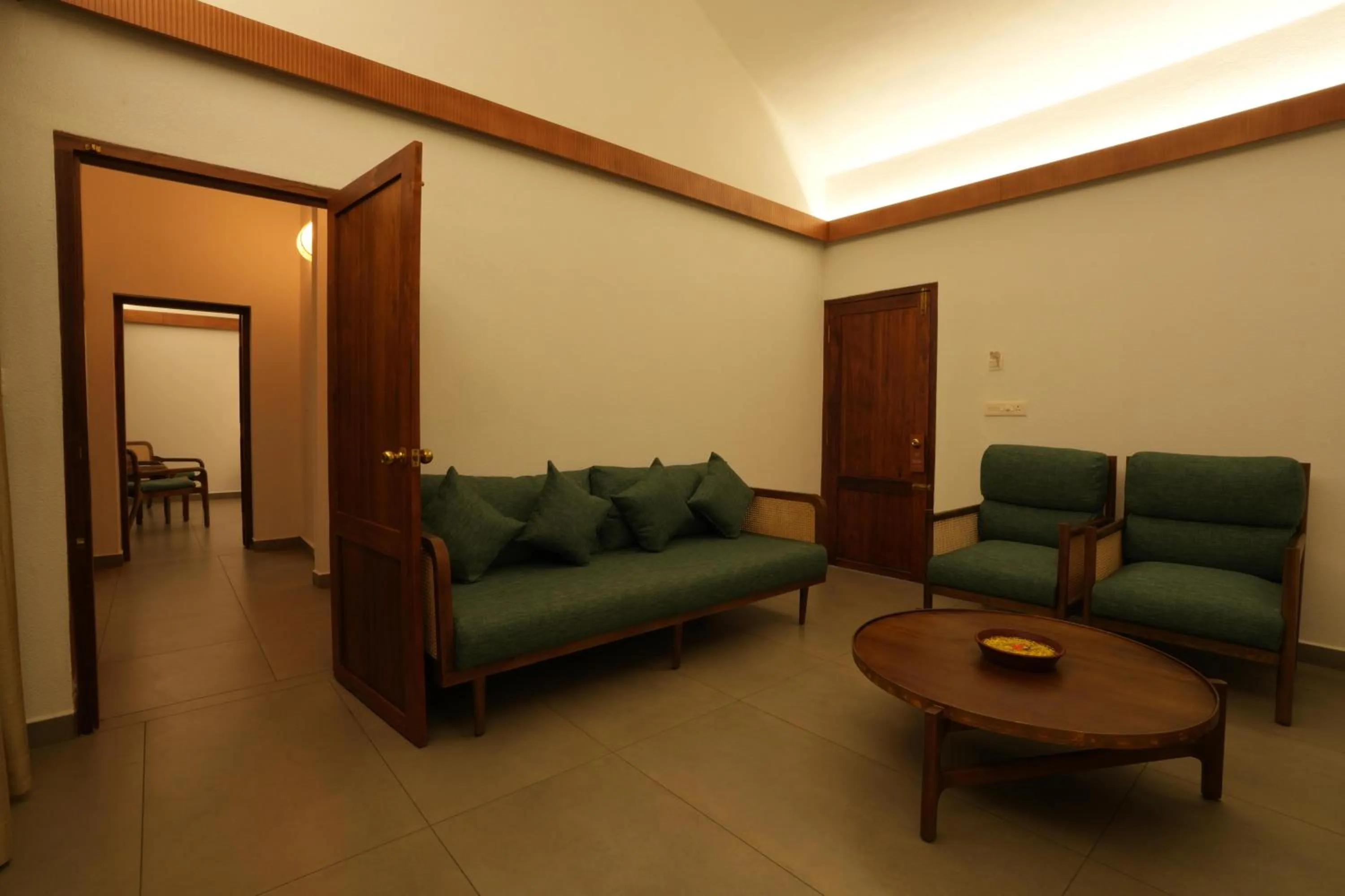 Living room in Cardamom County by Xandari