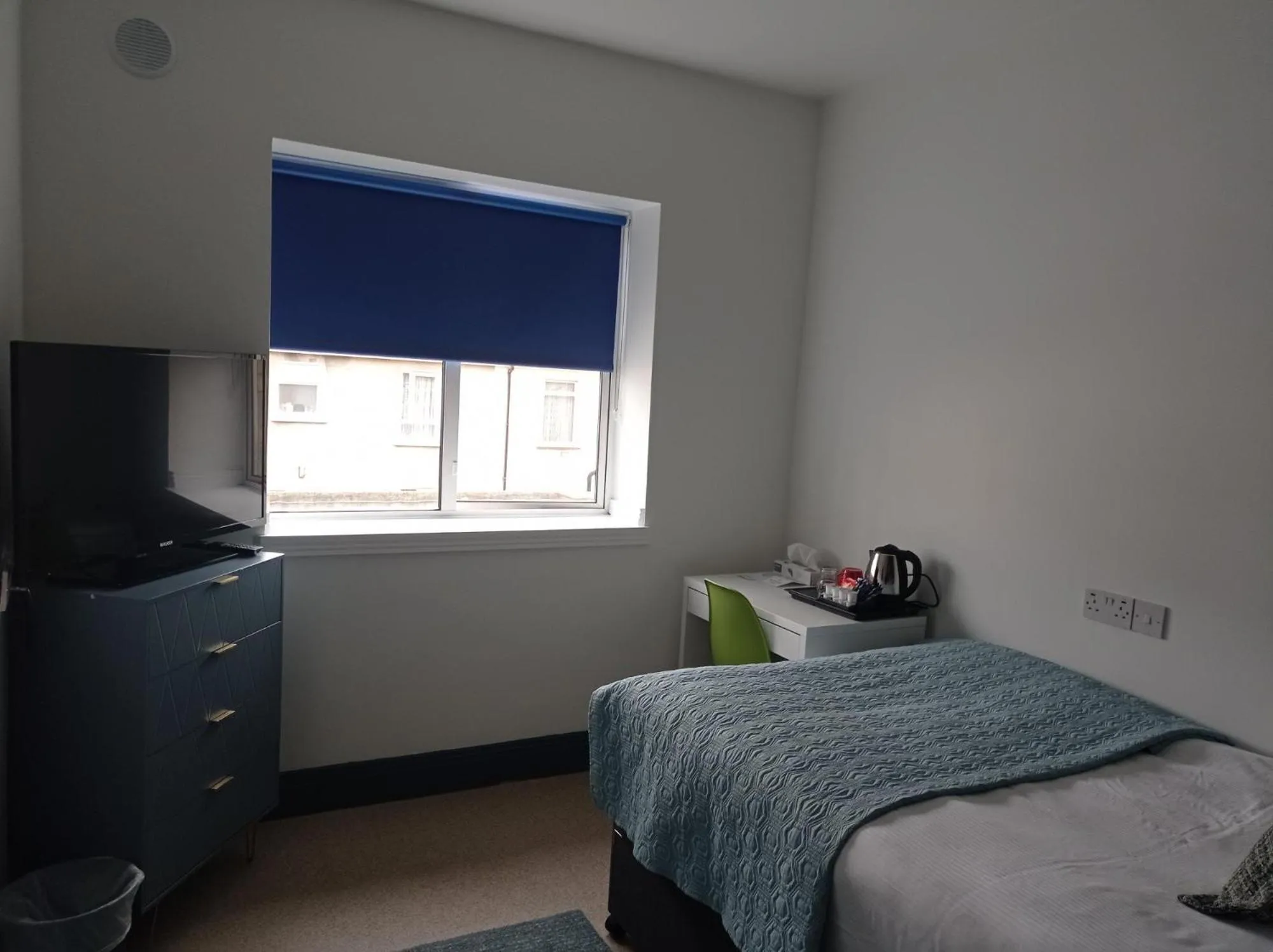 Bed in Tom Dick and Harriet's Accommodation