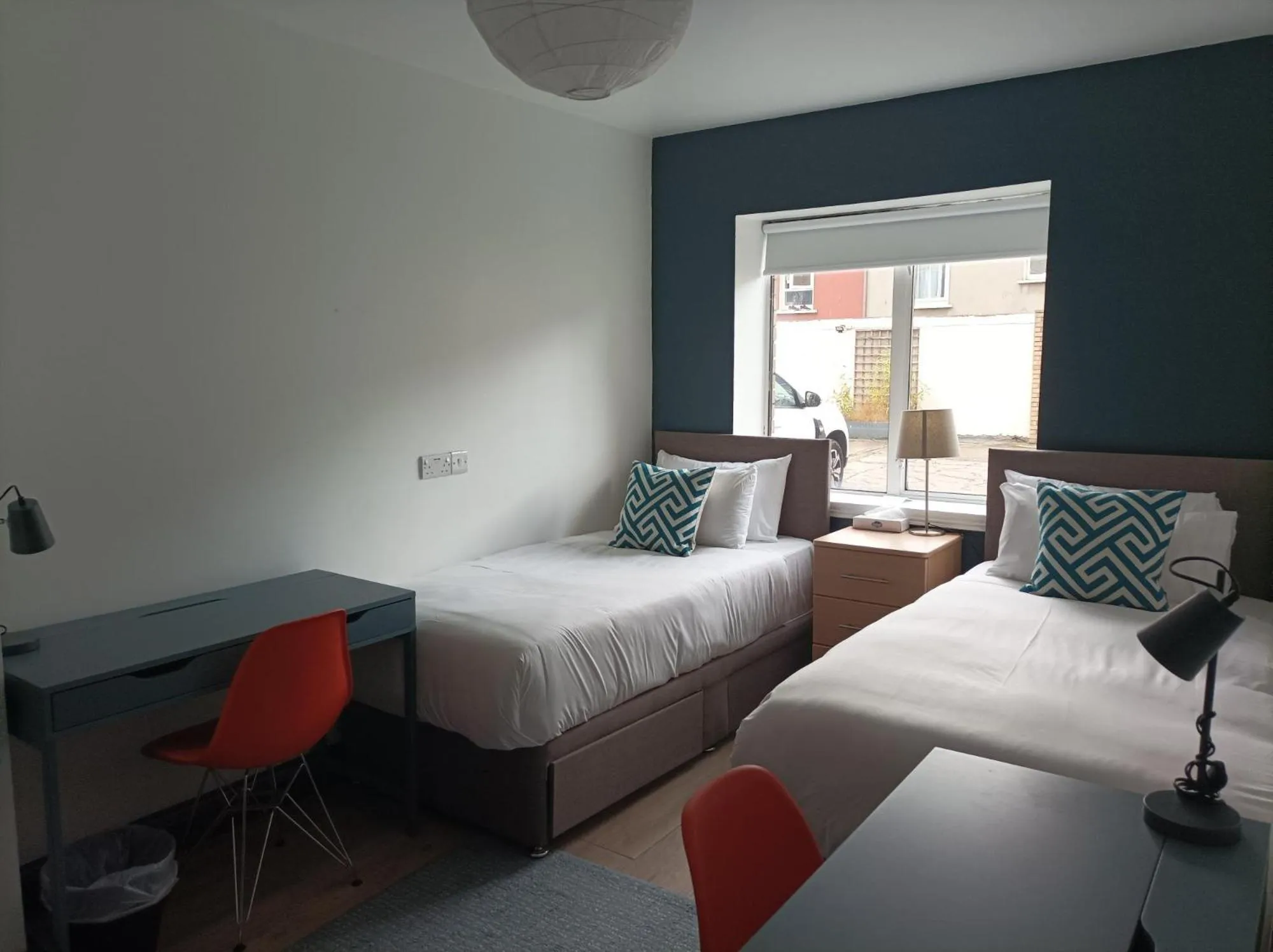 Bed in Tom Dick and Harriet's Accommodation