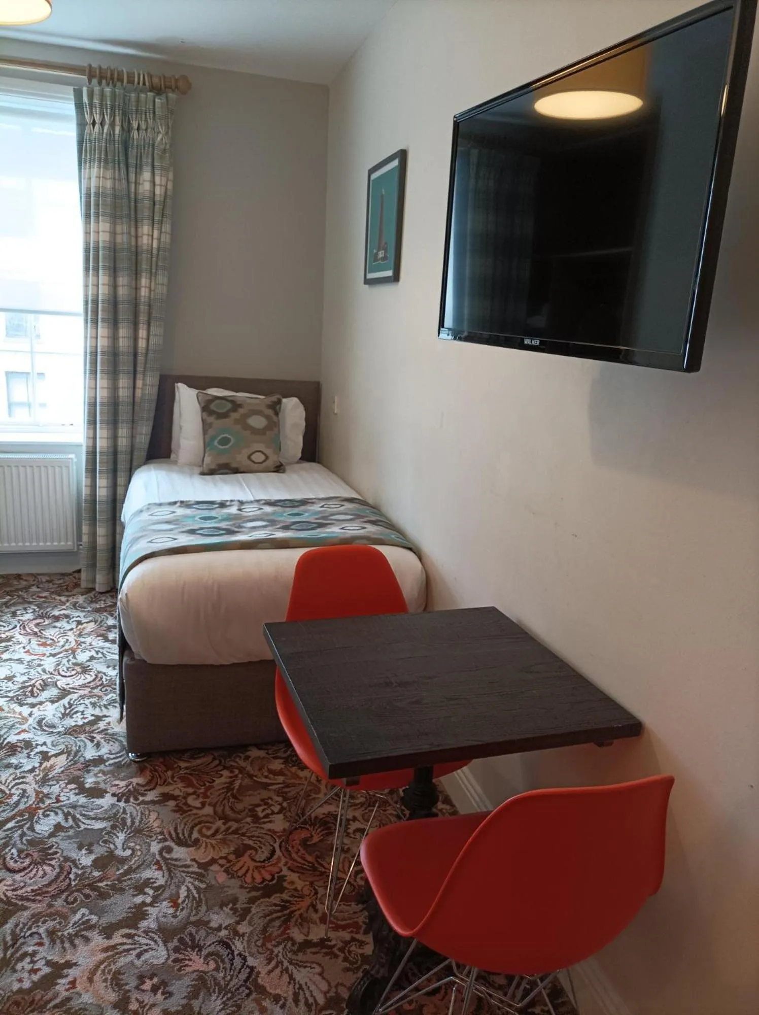 Bed in Tom Dick and Harriet's Accommodation