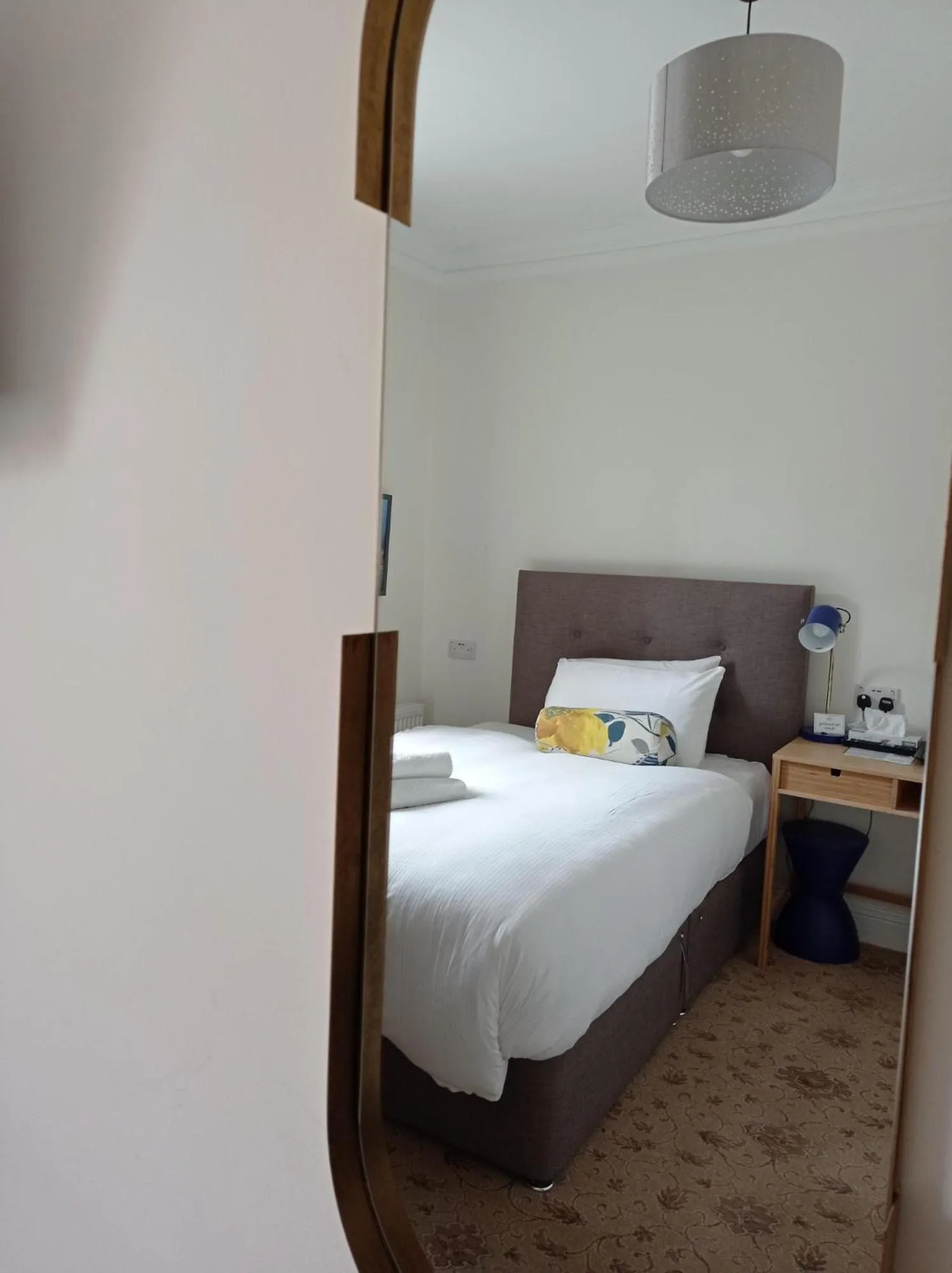 Bed in Tom Dick and Harriet's Accommodation