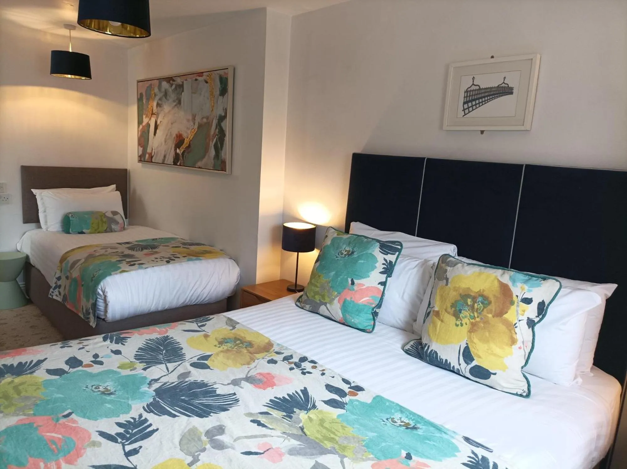 Bed in Tom Dick and Harriet's Accommodation