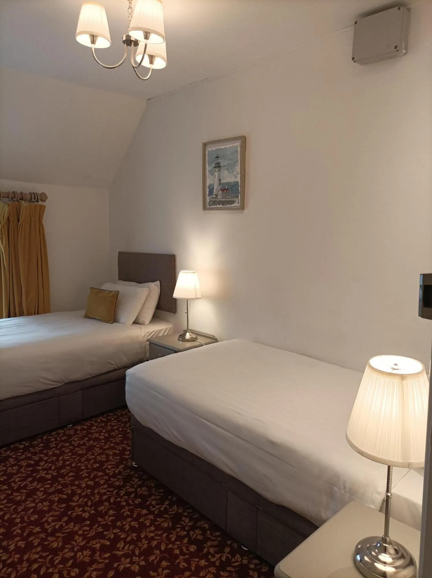 Bed in Tom Dick and Harriet's Accommodation