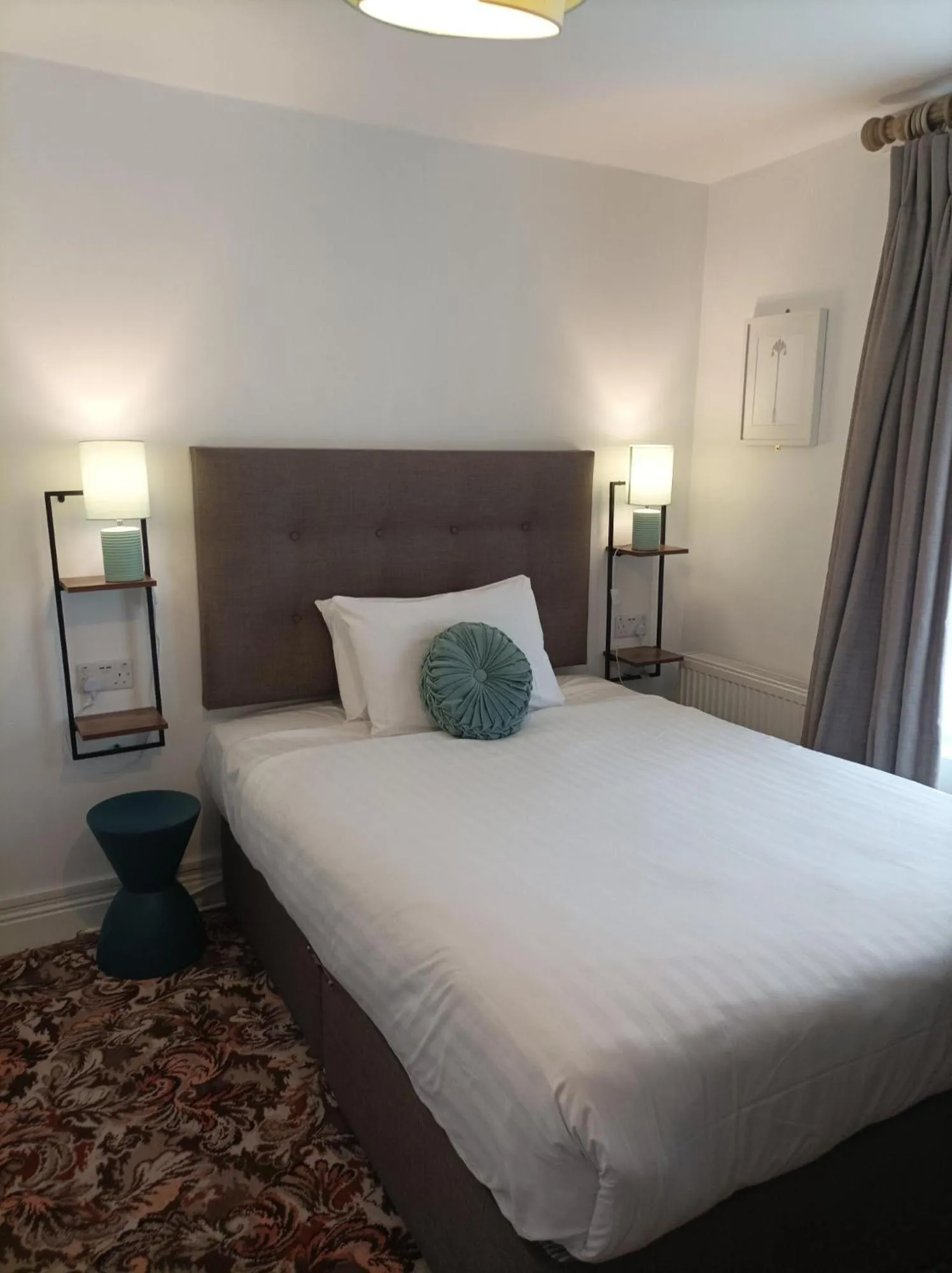 Bed in Tom Dick and Harriet's Accommodation