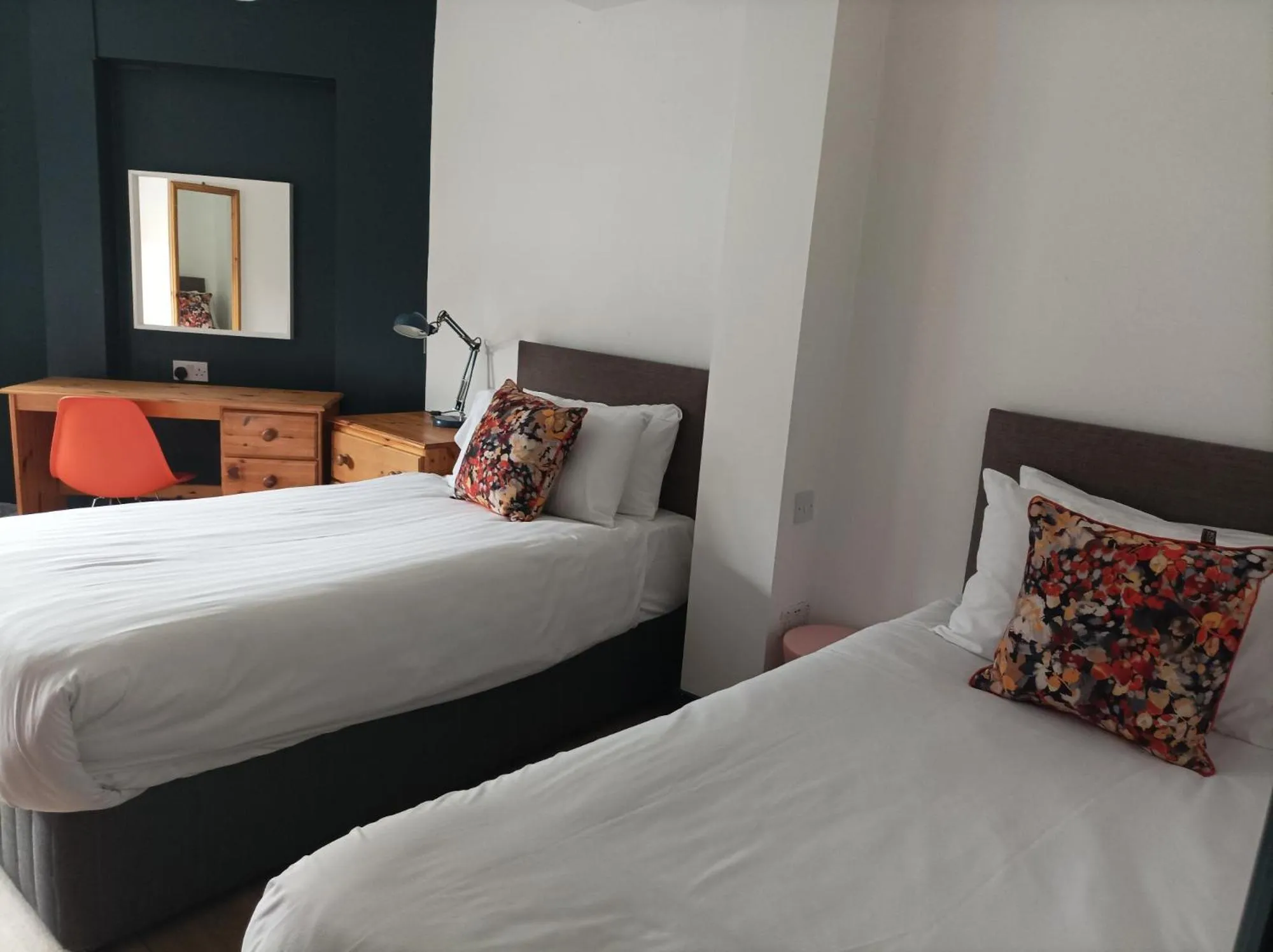 Bed in Tom Dick and Harriet's Accommodation